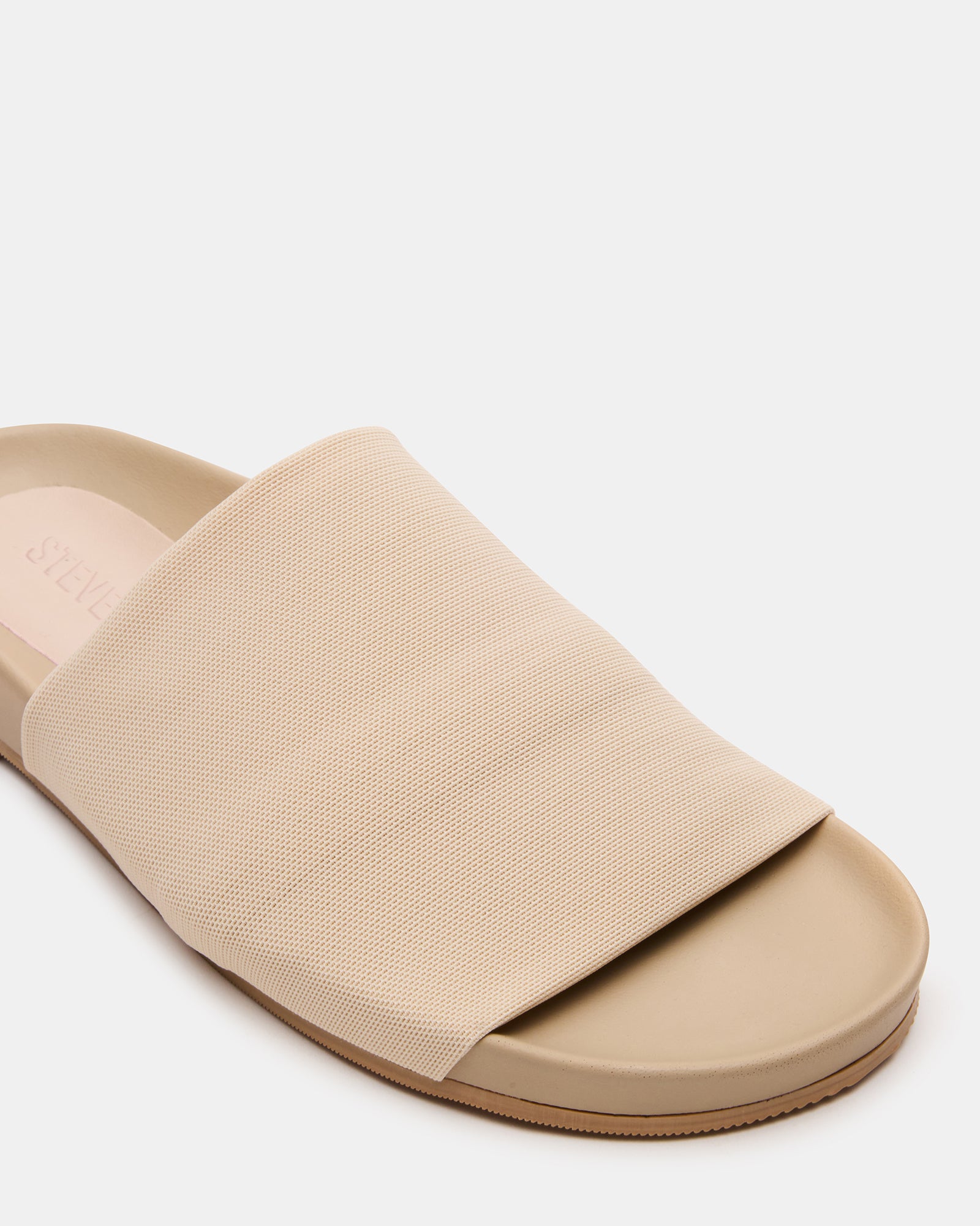 Woman wearing the Gucci-inspired platform slides with a casual outfit.