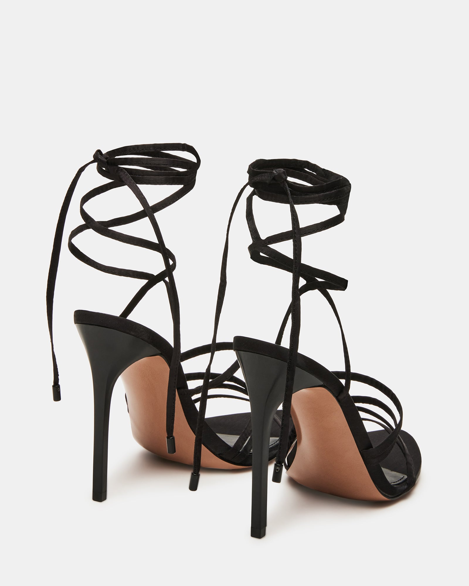 Top-down angle showing the elegant straps of black kitten heels with textile finish