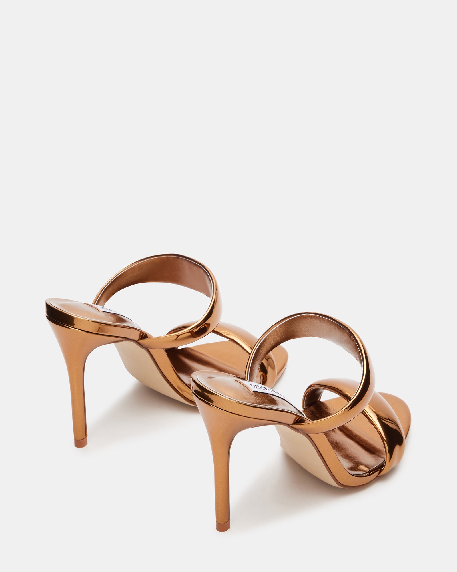 Close-up of the double strap design on gold high heel sandals