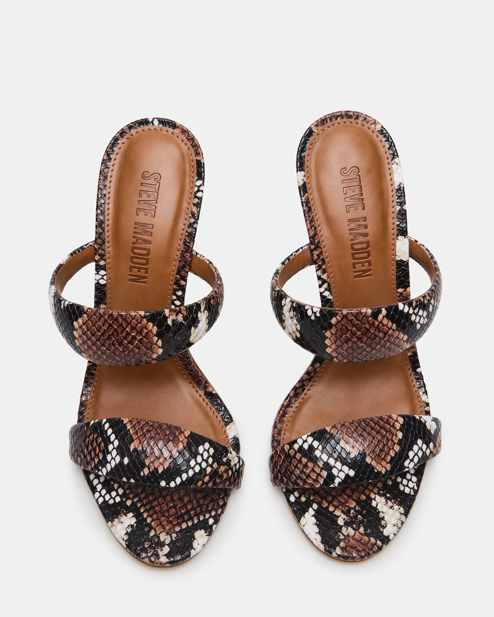 Close-up of the tubular double strap on brown heeled boots.