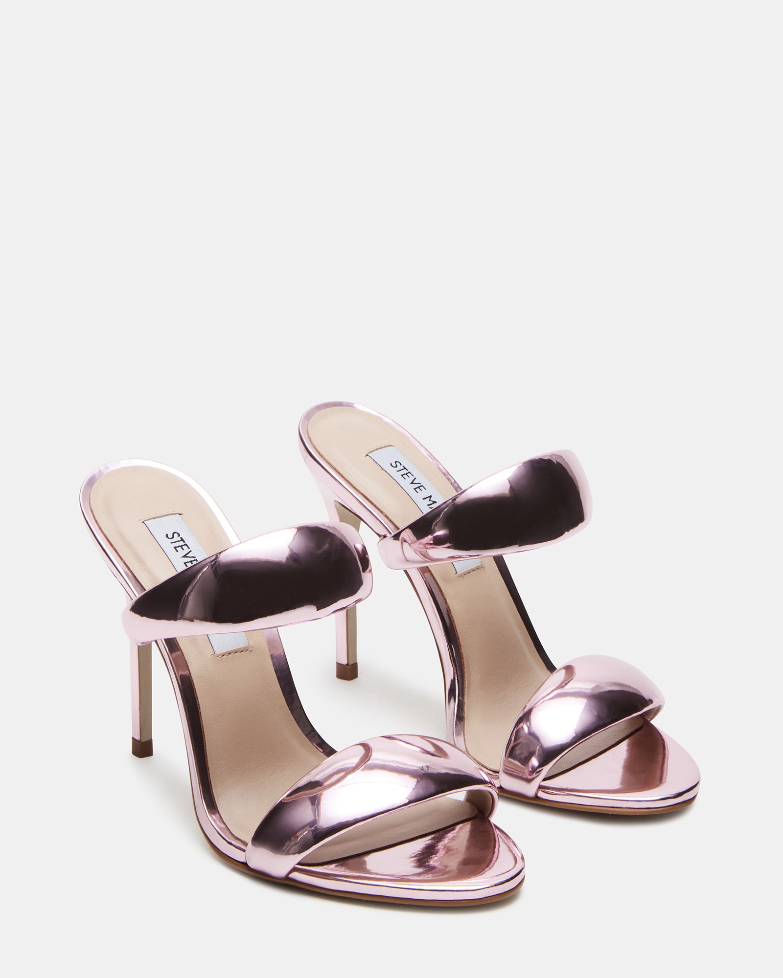 Side view of heeled mules black double strap design on a model
