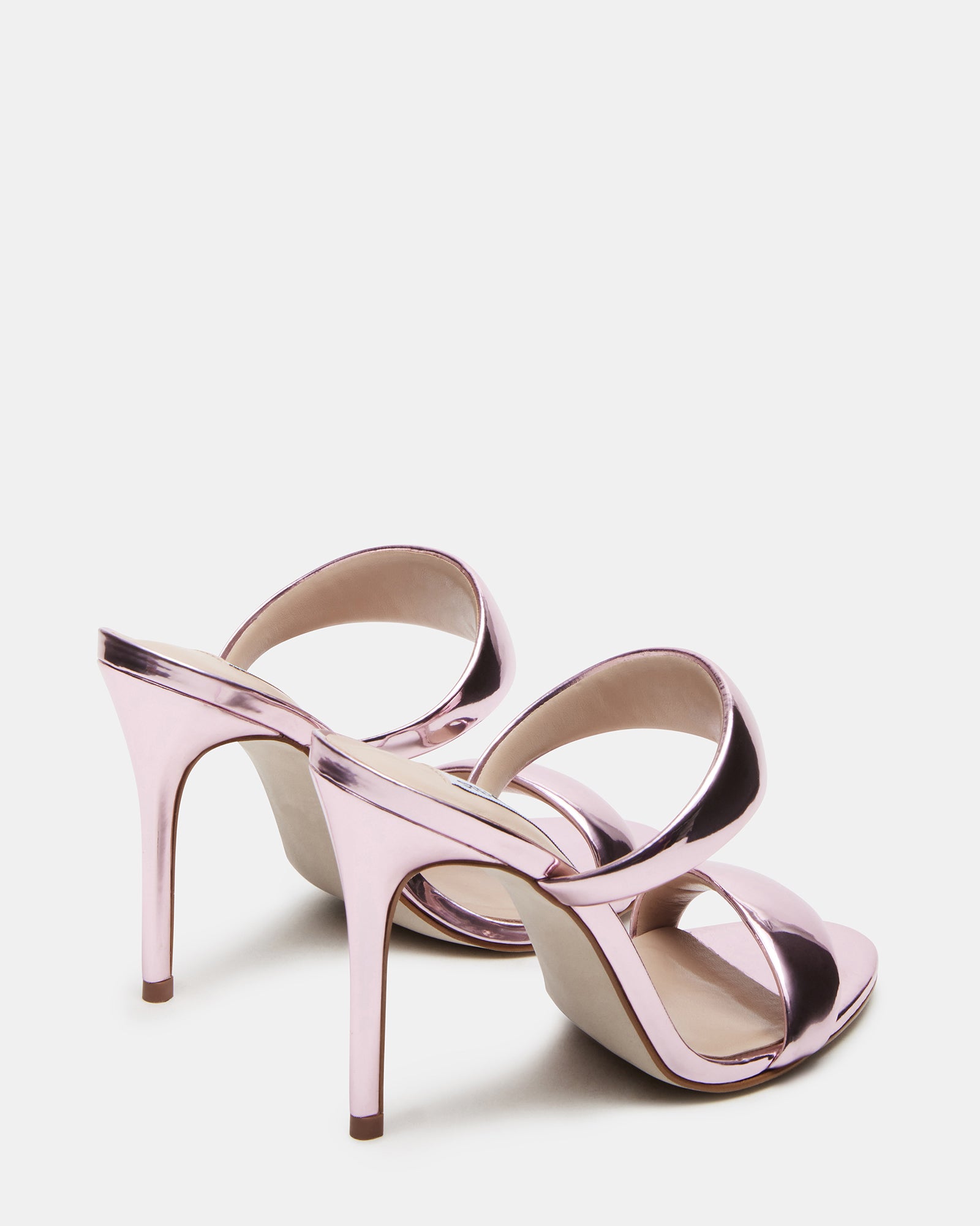 Side view of heeled mules black double strap design on a model