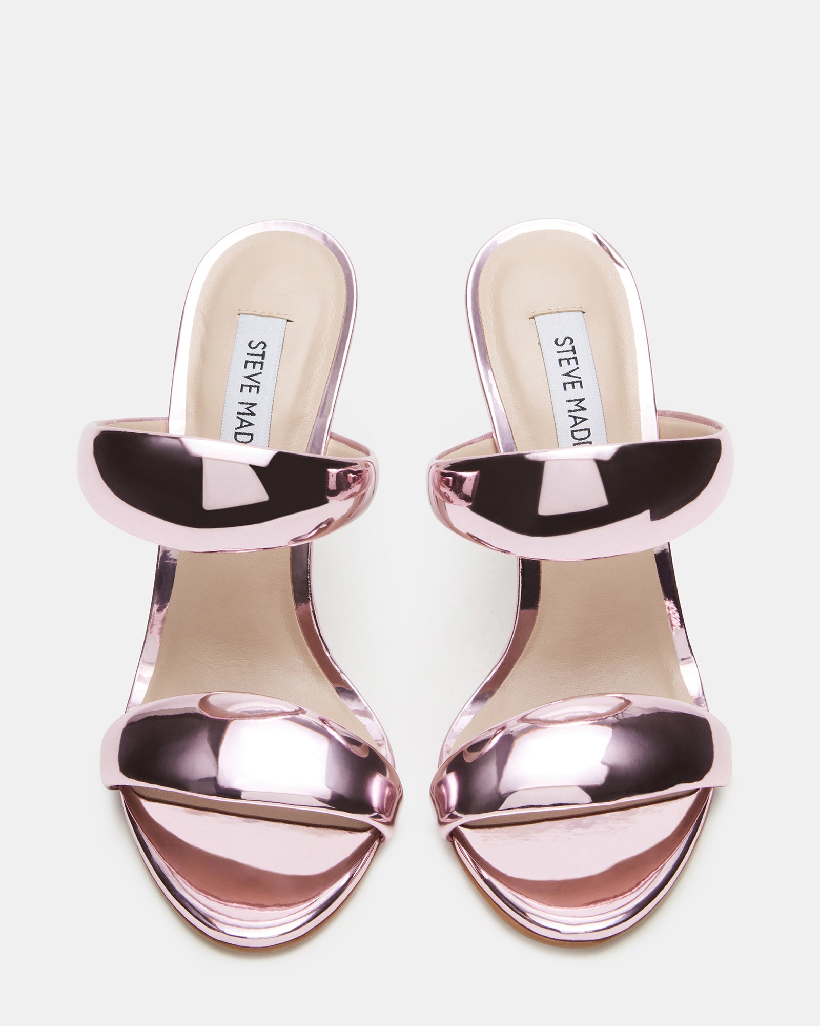 Close-up of Saturn pink metallic mule heels showing stiletto heel detail