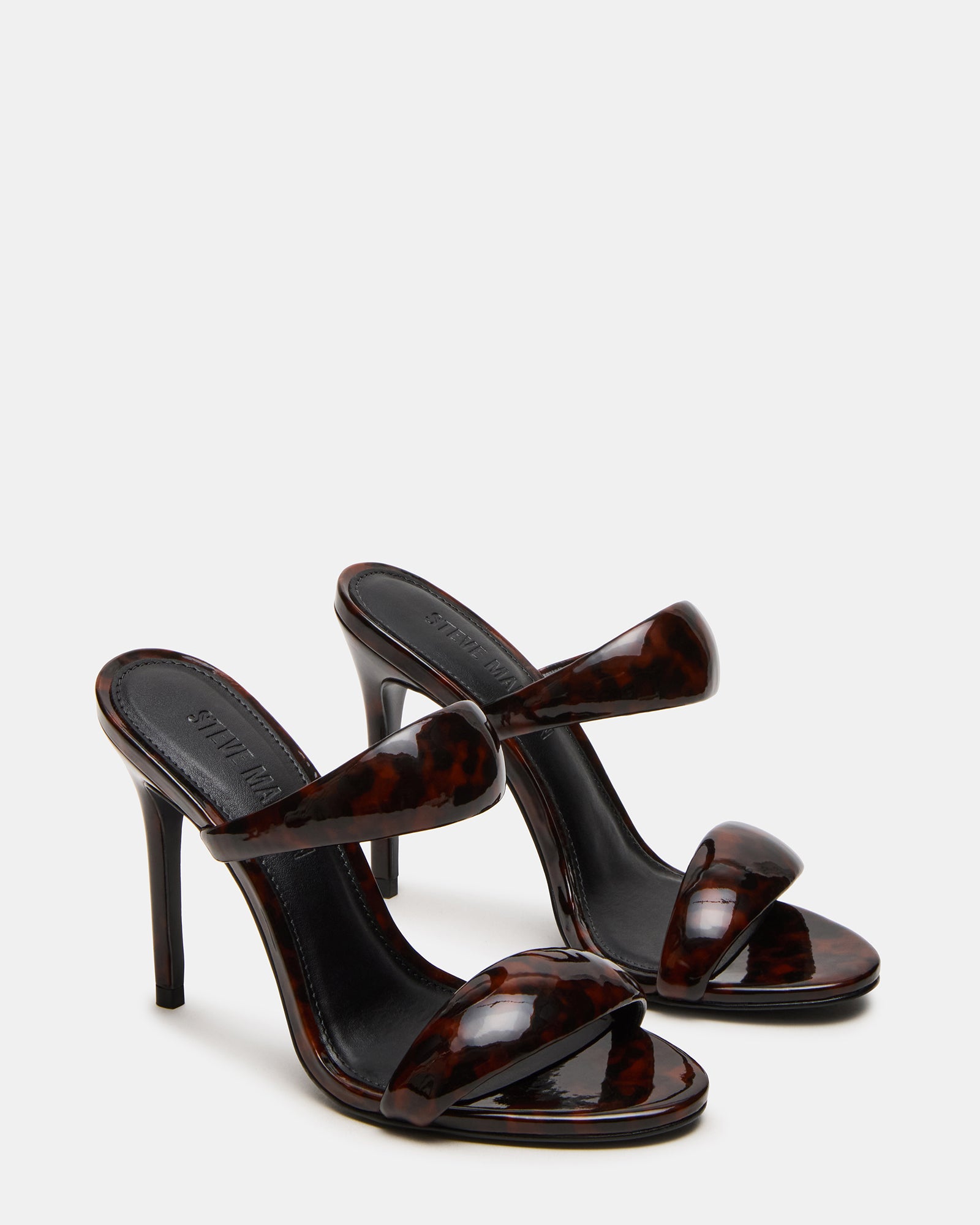 Fashionable Saturn Tortoise heels paired with evening outfit