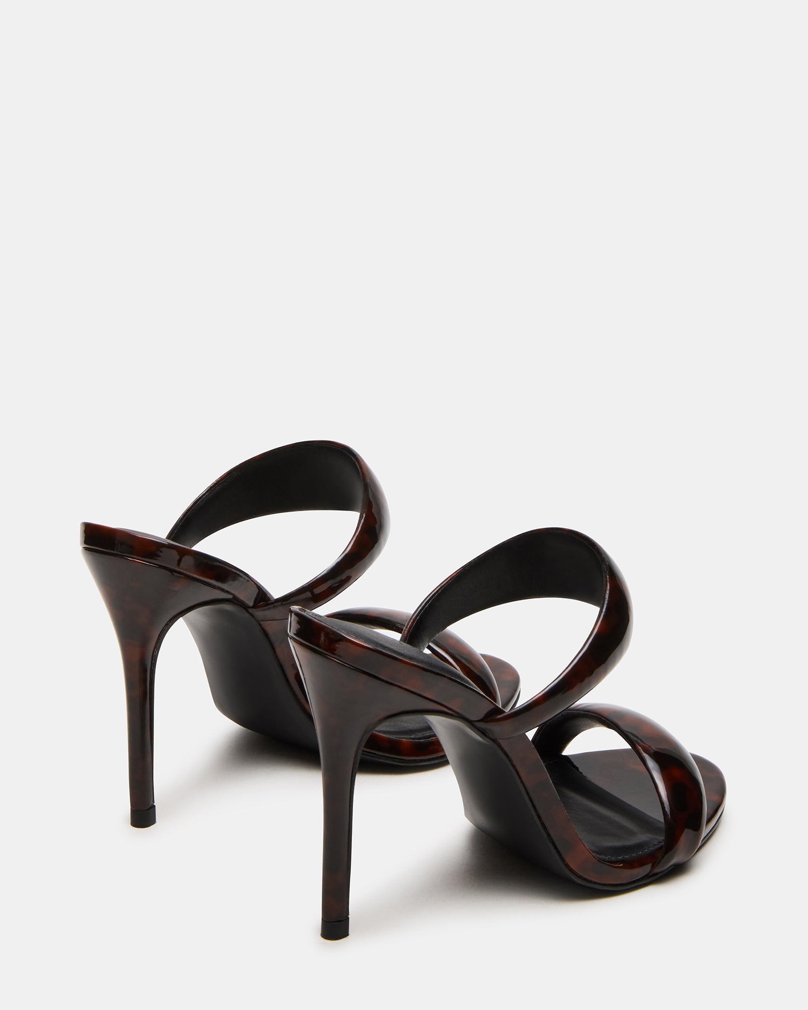 Fashionable Saturn Tortoise heels paired with evening outfit