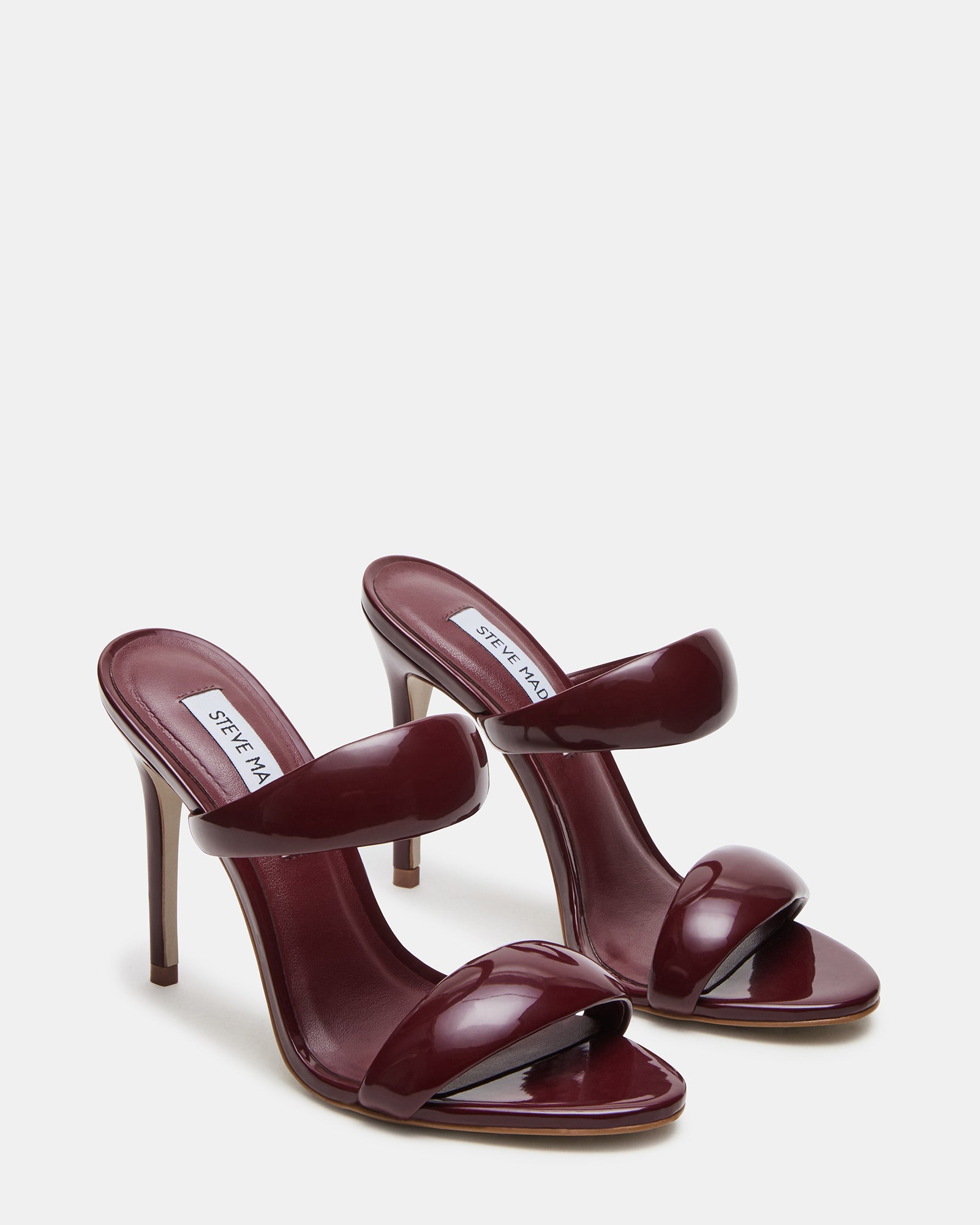Close-up of synthetic sole and strap details on Saturn Wine Patent mules