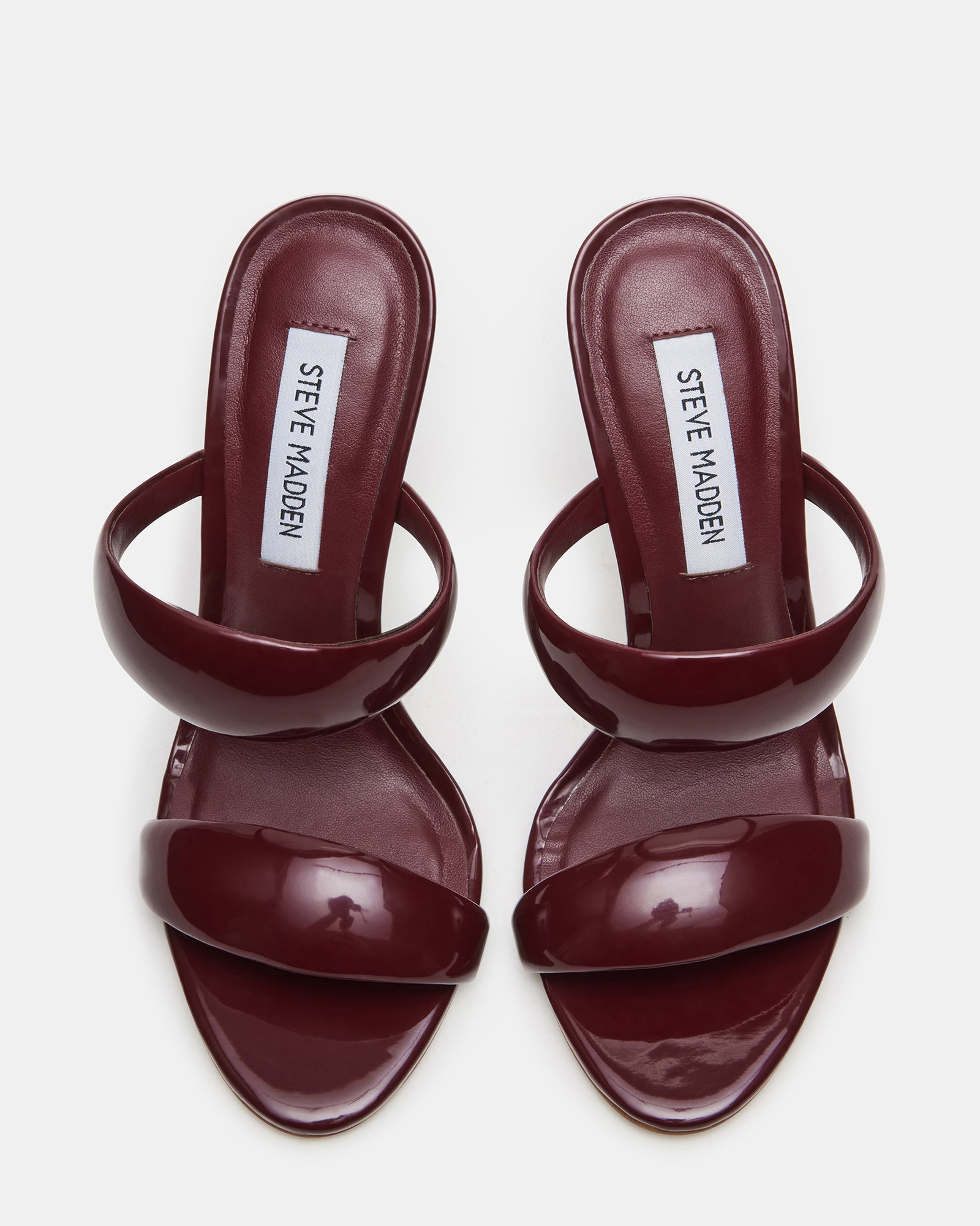 Front view of fashionable Saturn Wine Patent mules showing stylish design