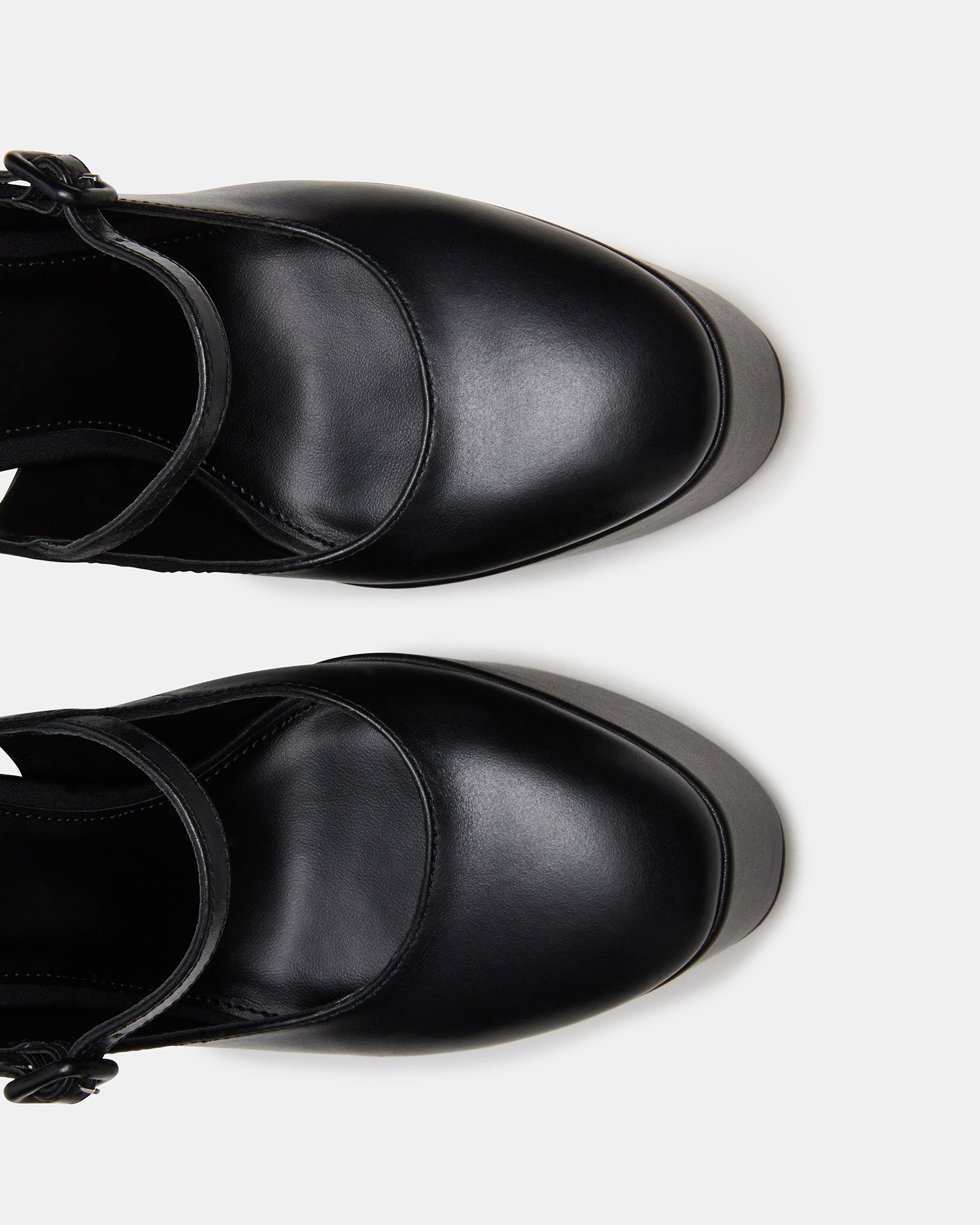 Side view of black leather platform block heels with ankle strap