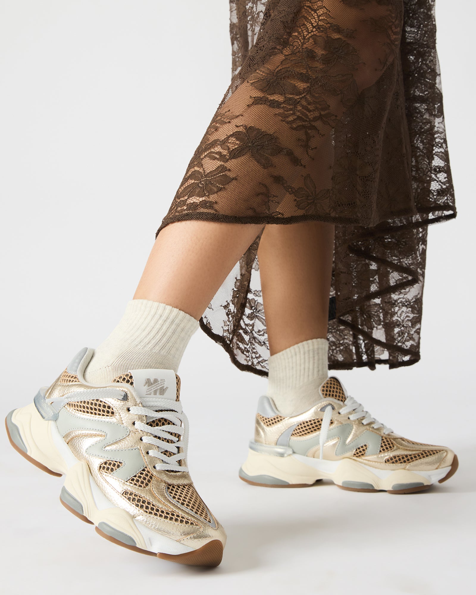 SEBI sneakers styled with workwear, showing heel height and comfort