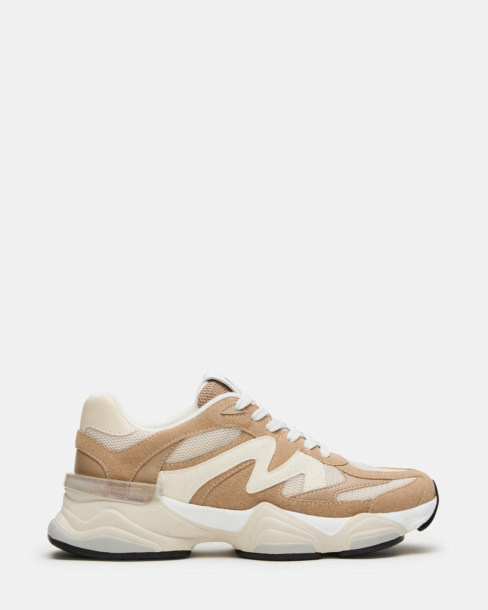 Side view of taupe fashion sneakers for women, showcasing stylish design.