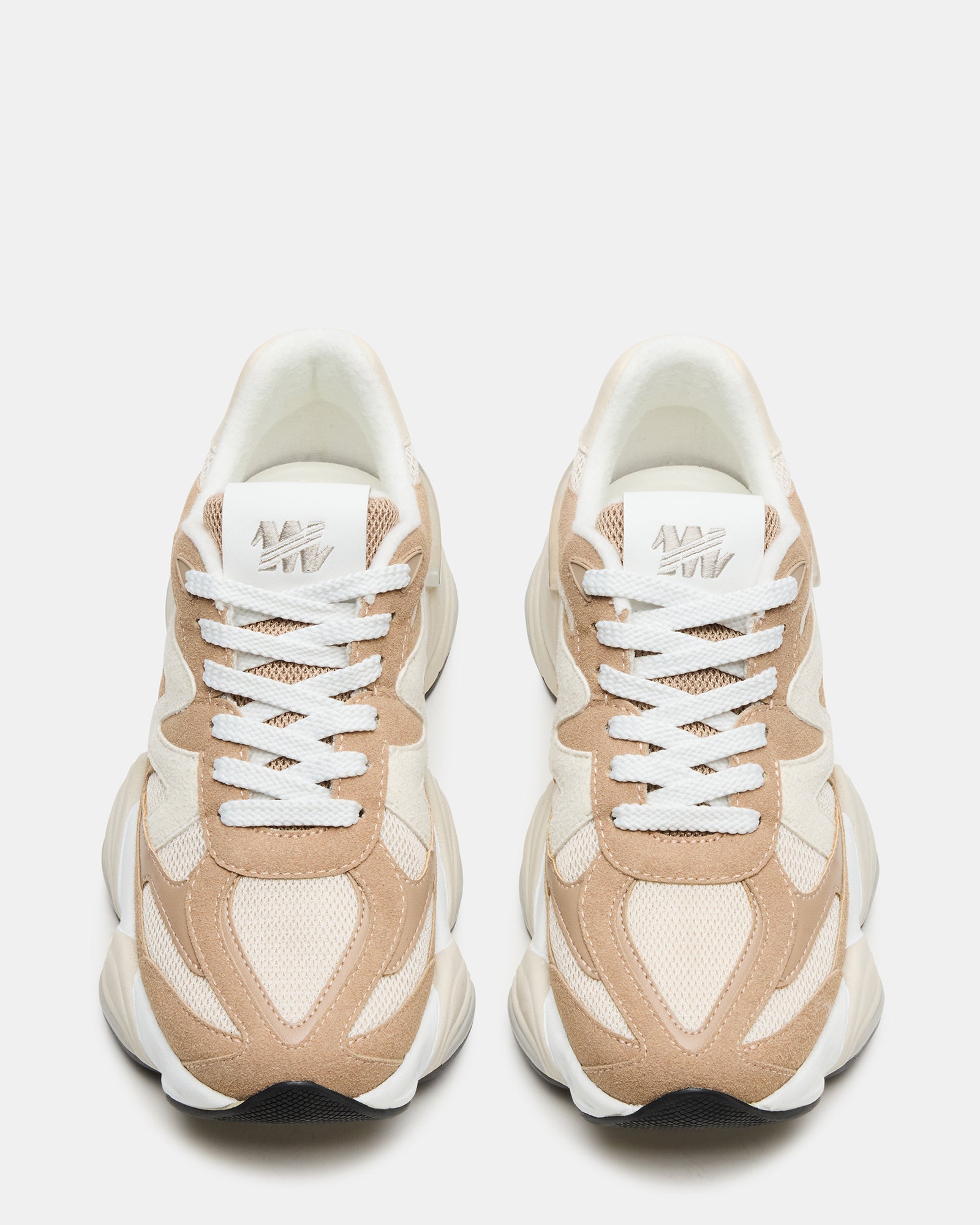 Close-up of the lace-up detail on taupe womens sneakers, highlighting quality materials.