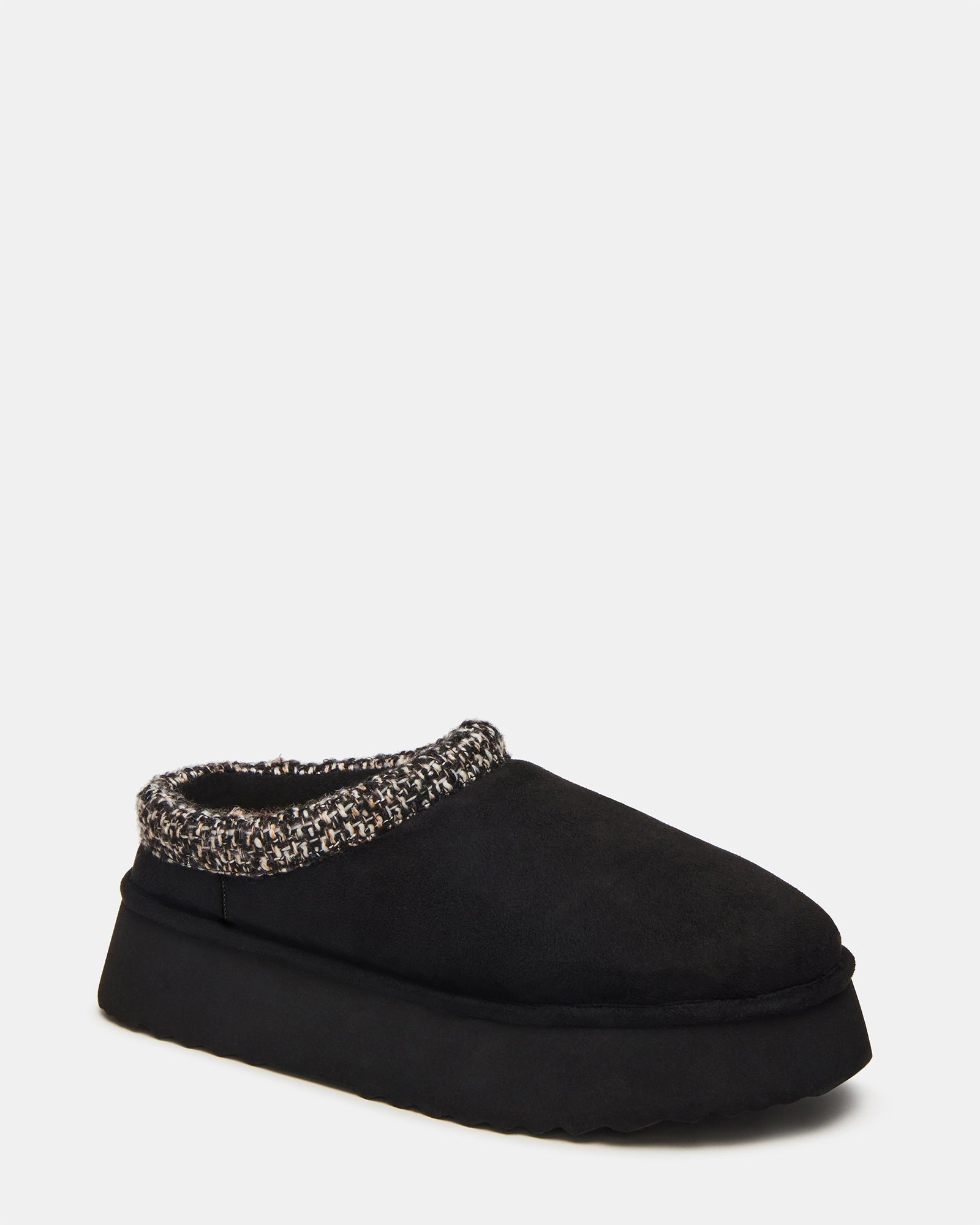 Close-up of faux fur lining in slip-on shoes for women.