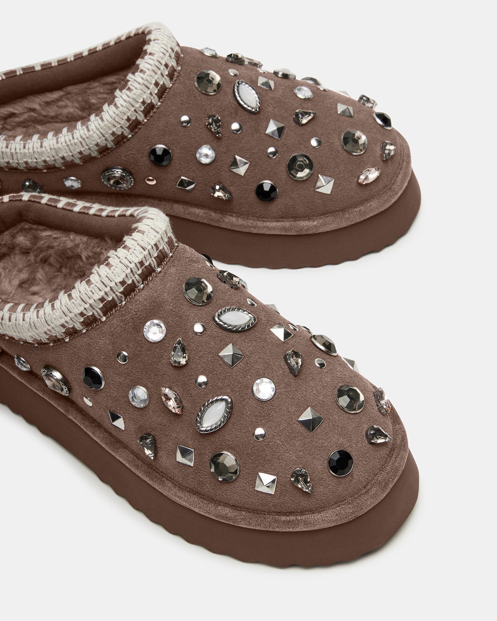 Top view of mule slippers showing faux fur lining and rhinestone suede slip-ons