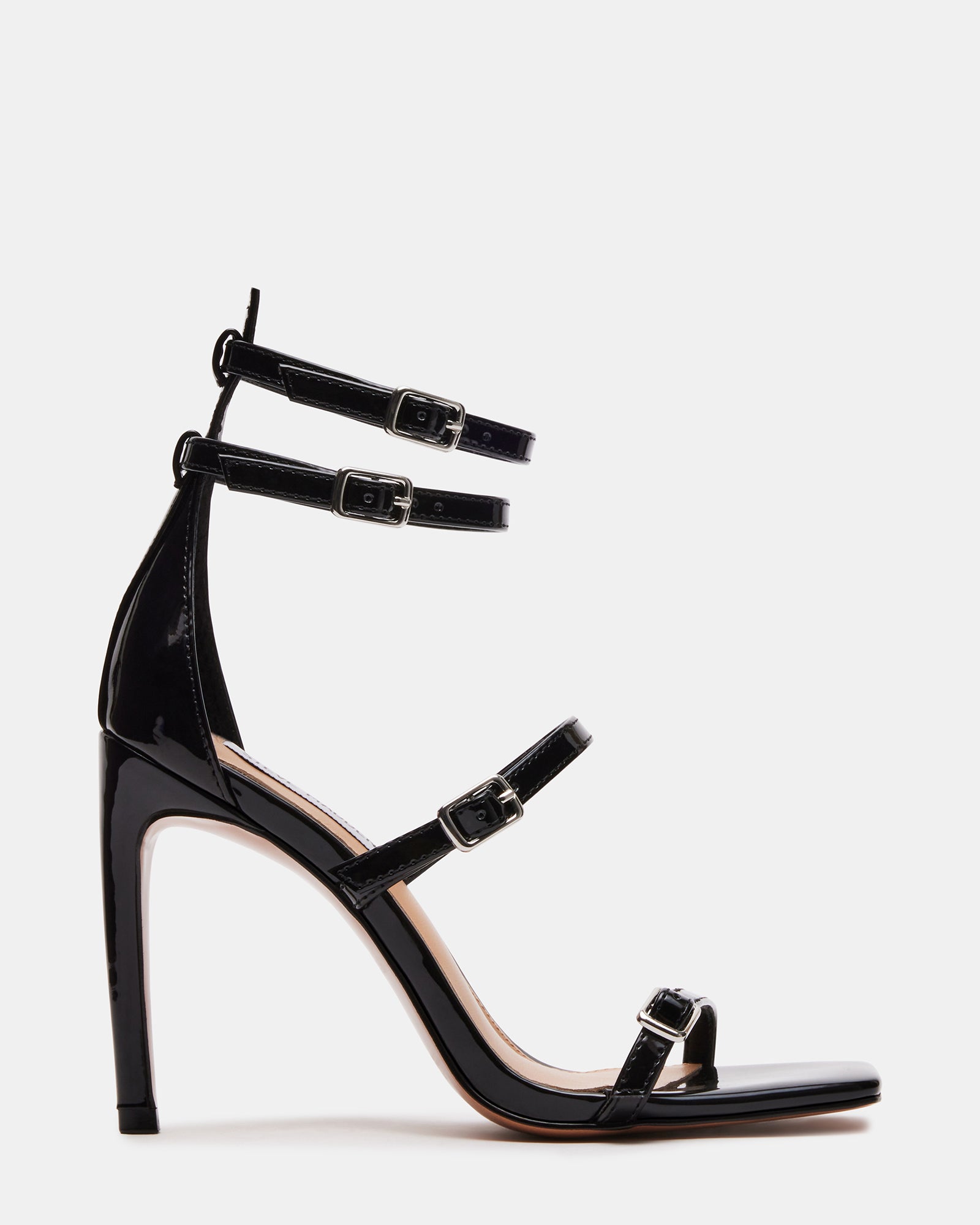 Side view of black strappy heels with square toe and stiletto heel