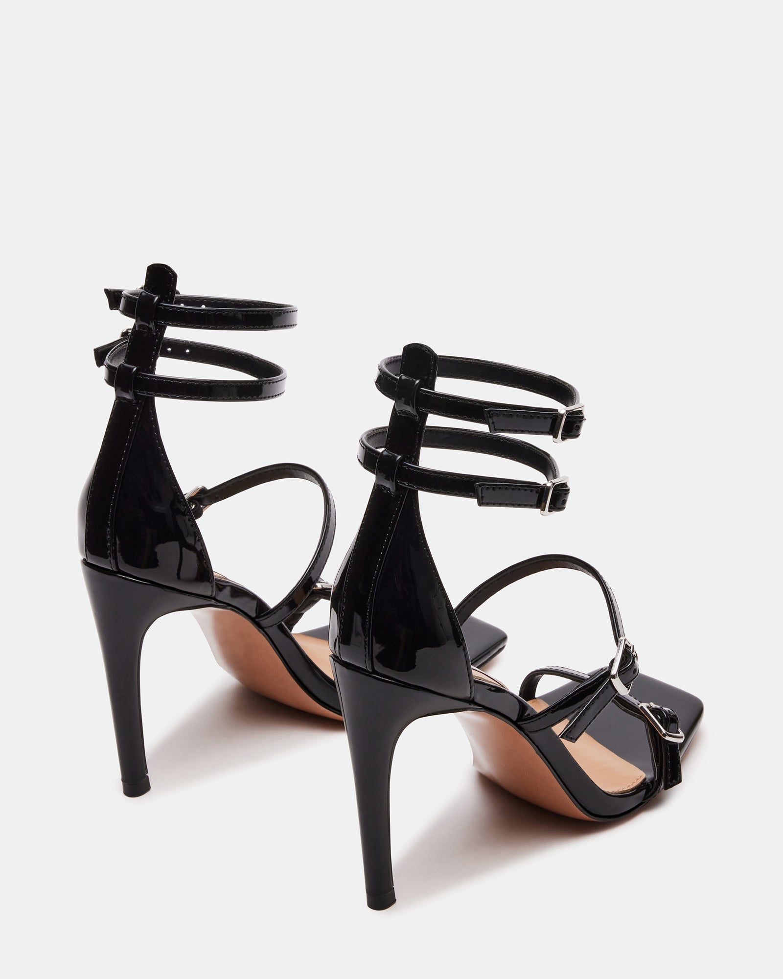 Black platform shoes styled with a cocktail dress for evening wear