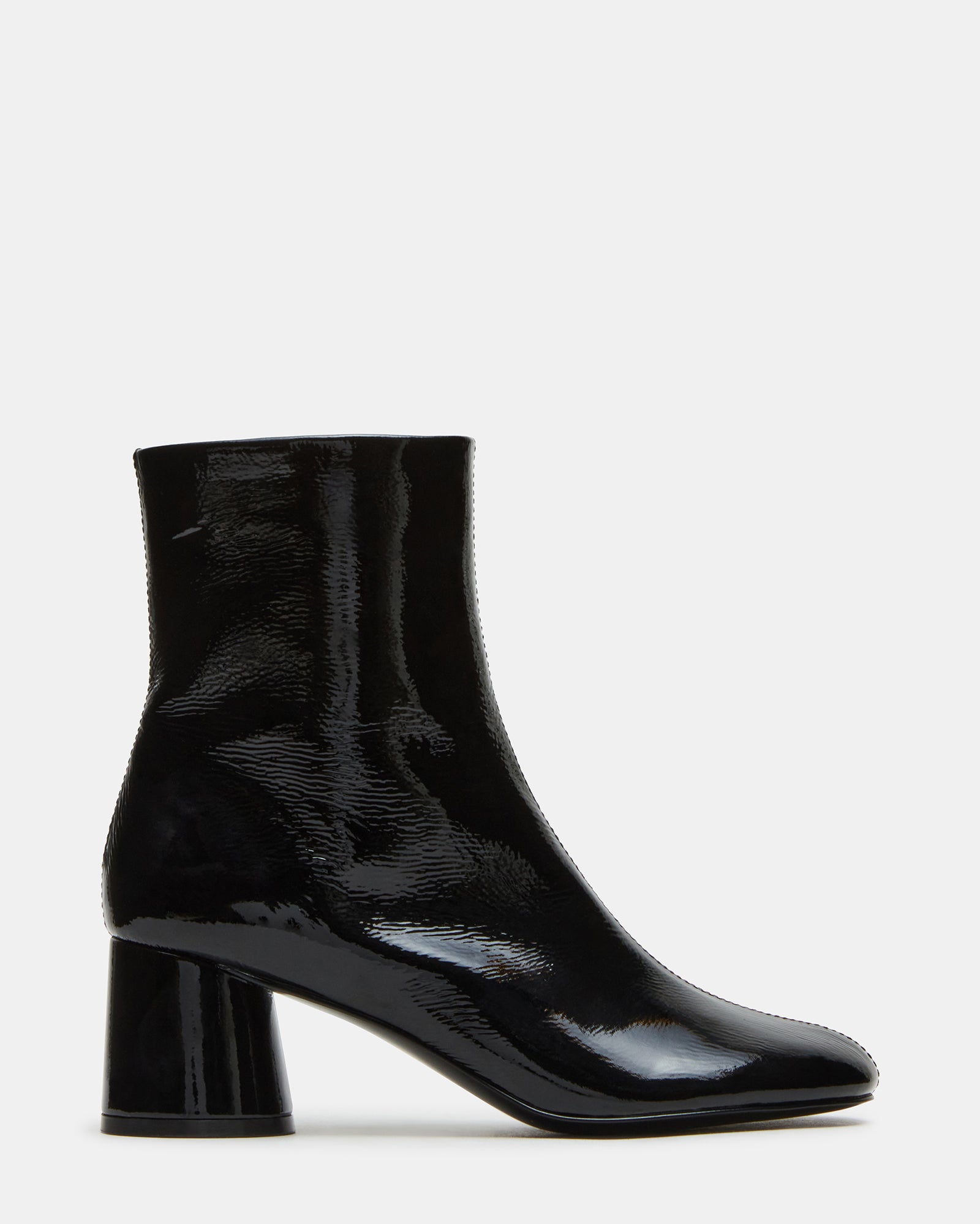 Side view of black leather boots with round toe and block heel