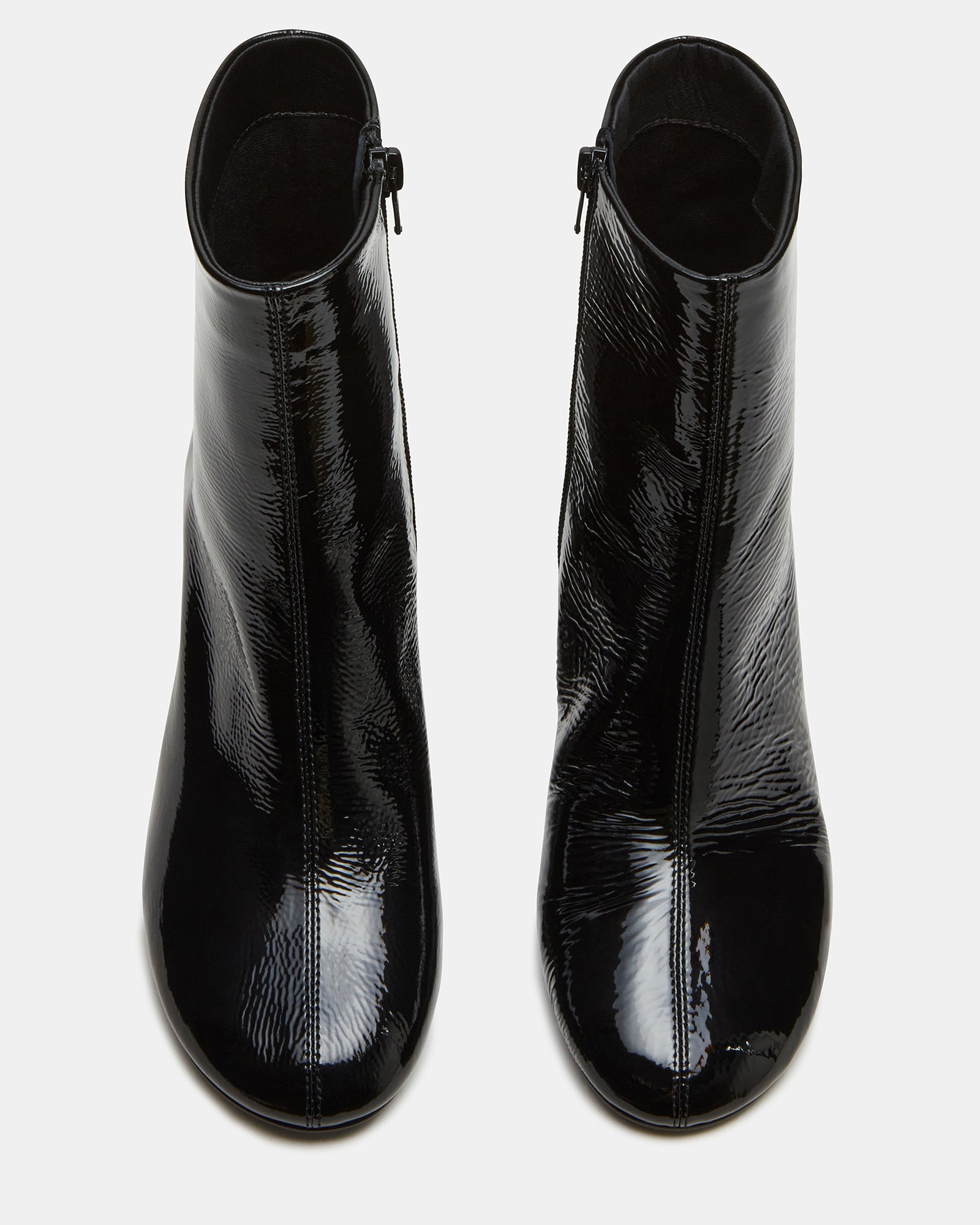 Side view of black leather boots with round toe and block heel