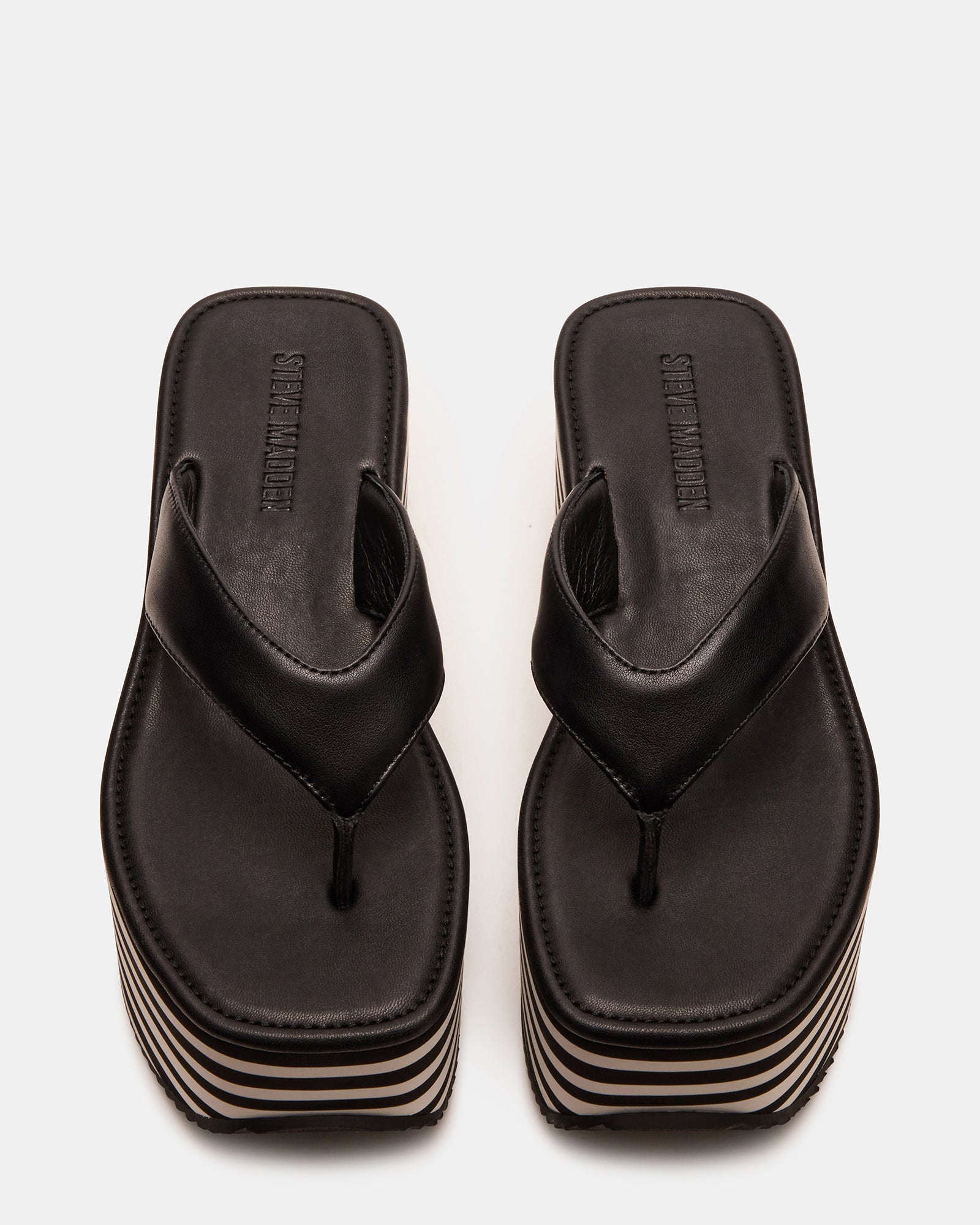 Close-up of Sevilla black platform sandals with chunky heel and square toe design.