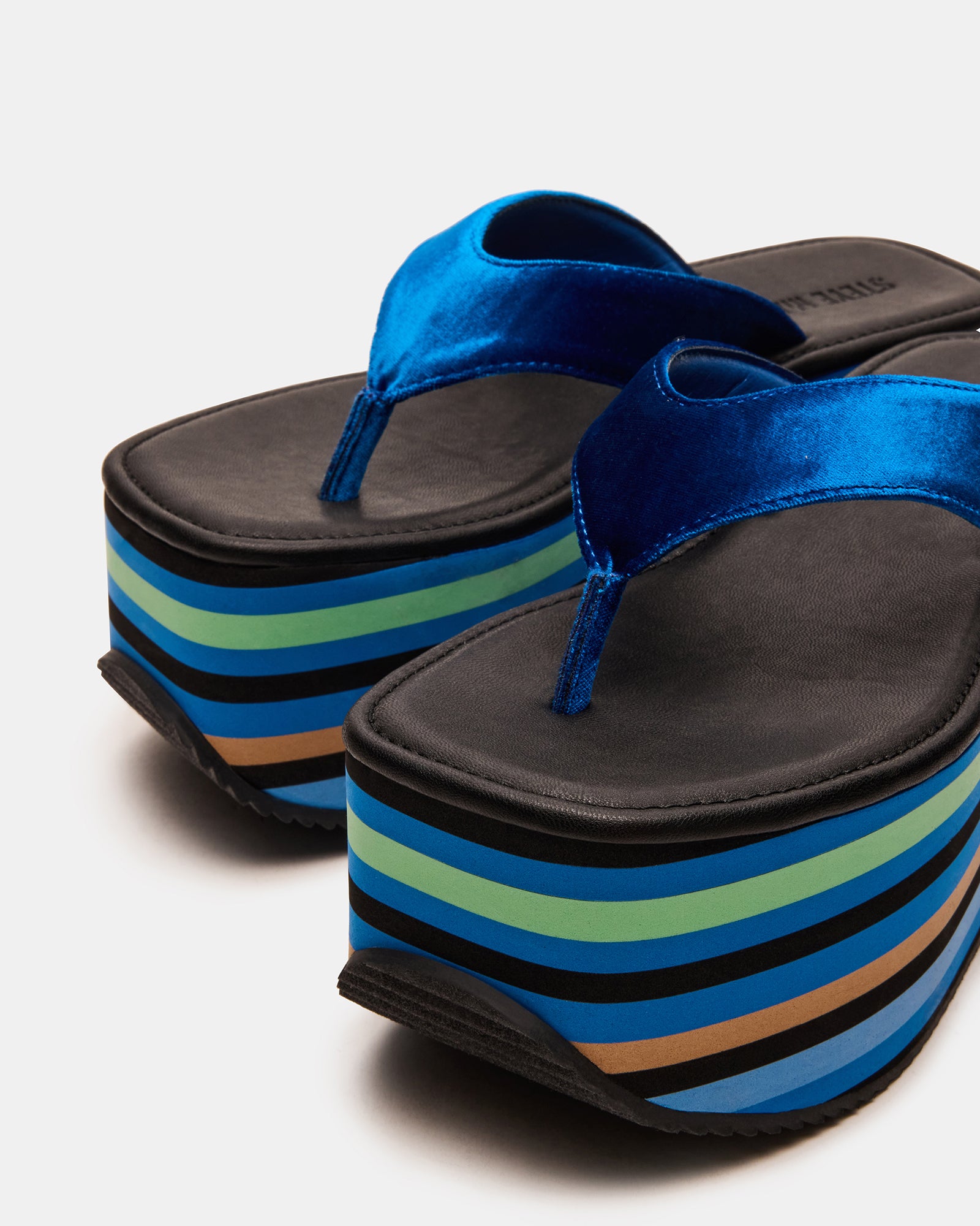 Close-up of Gucci-inspired thong sandals, perfect for summer outings.
