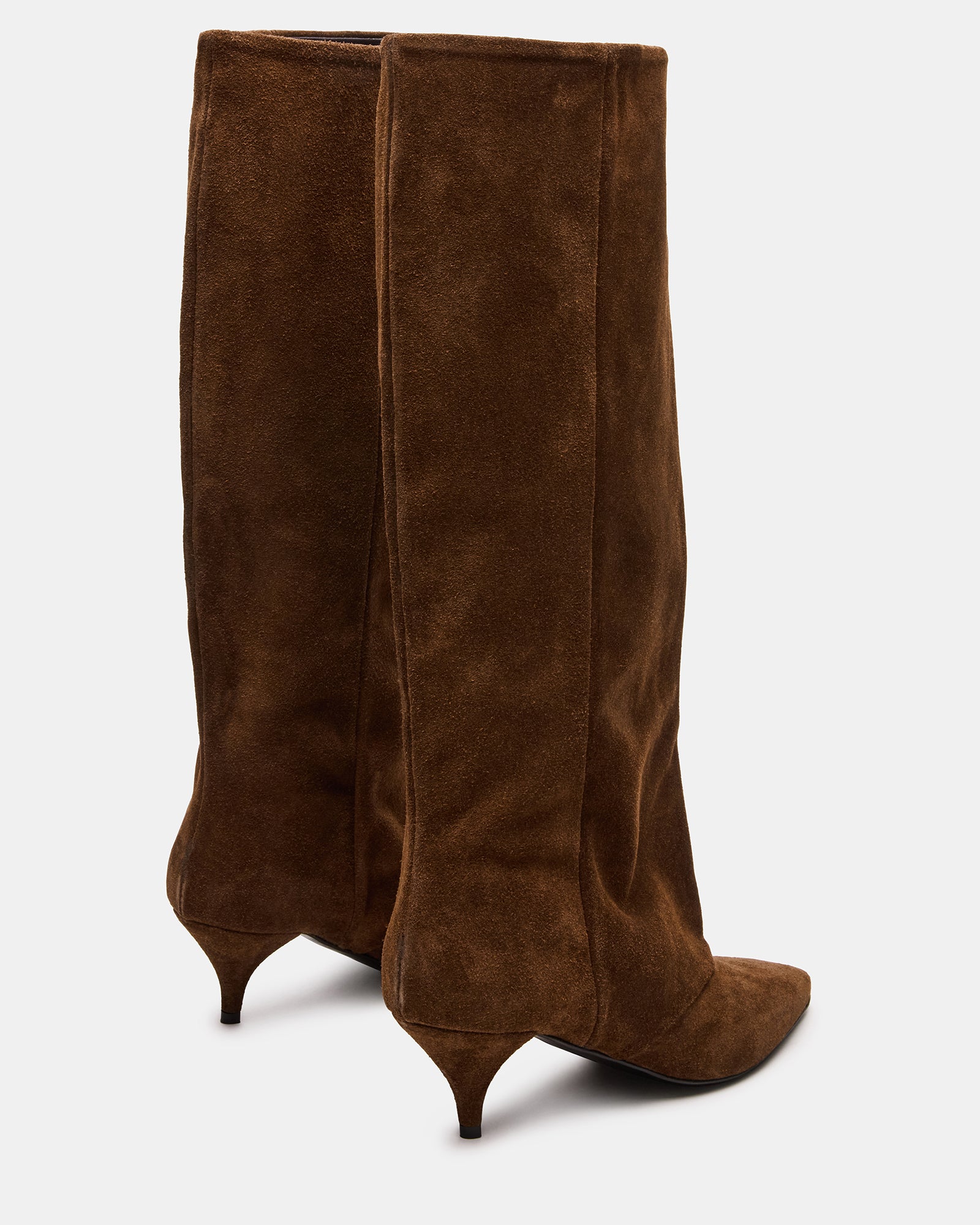 Close-up of pointed toe boots in chestnut suede on sidewalk