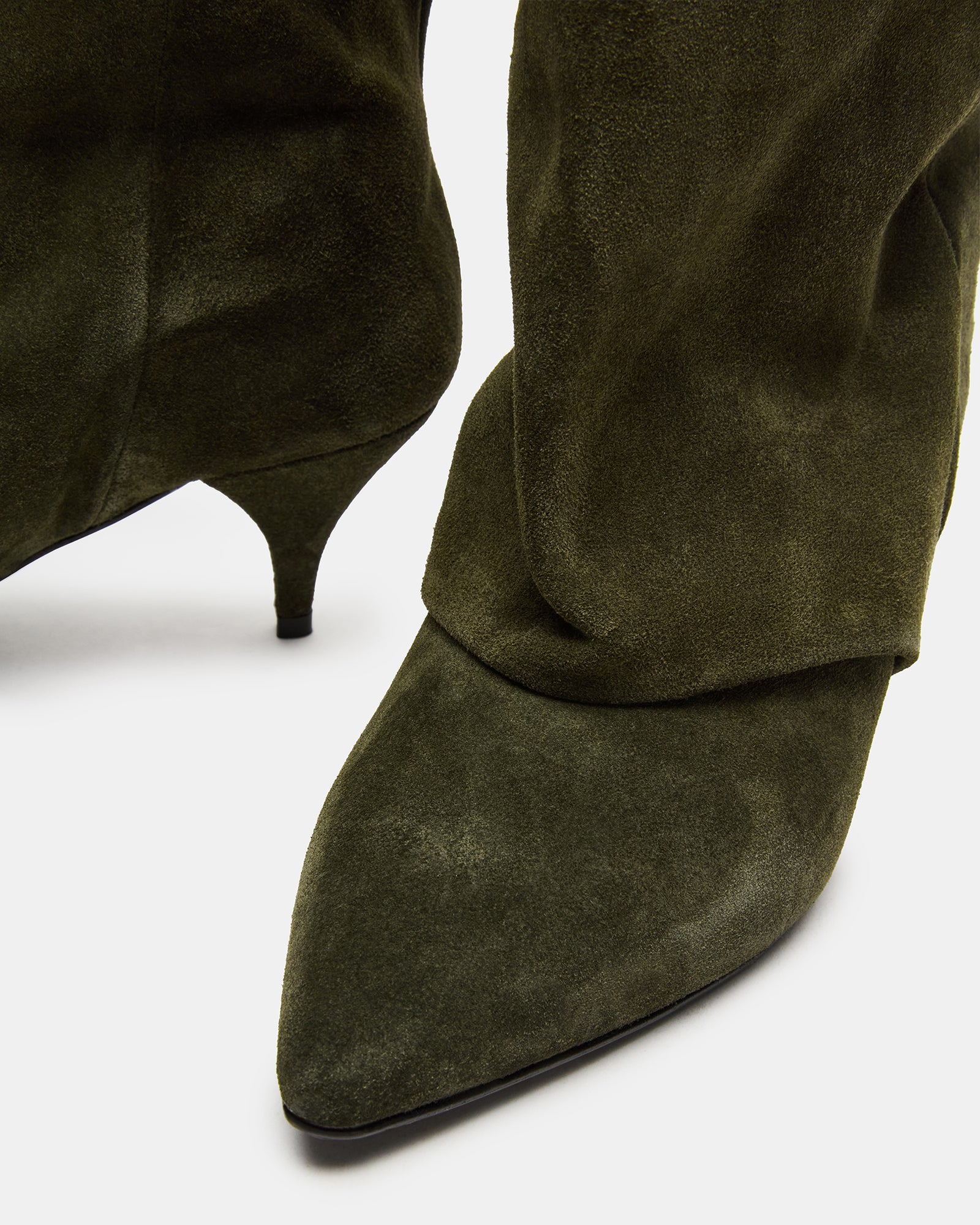 Close-up of olive suede upper and pointed toe design for women