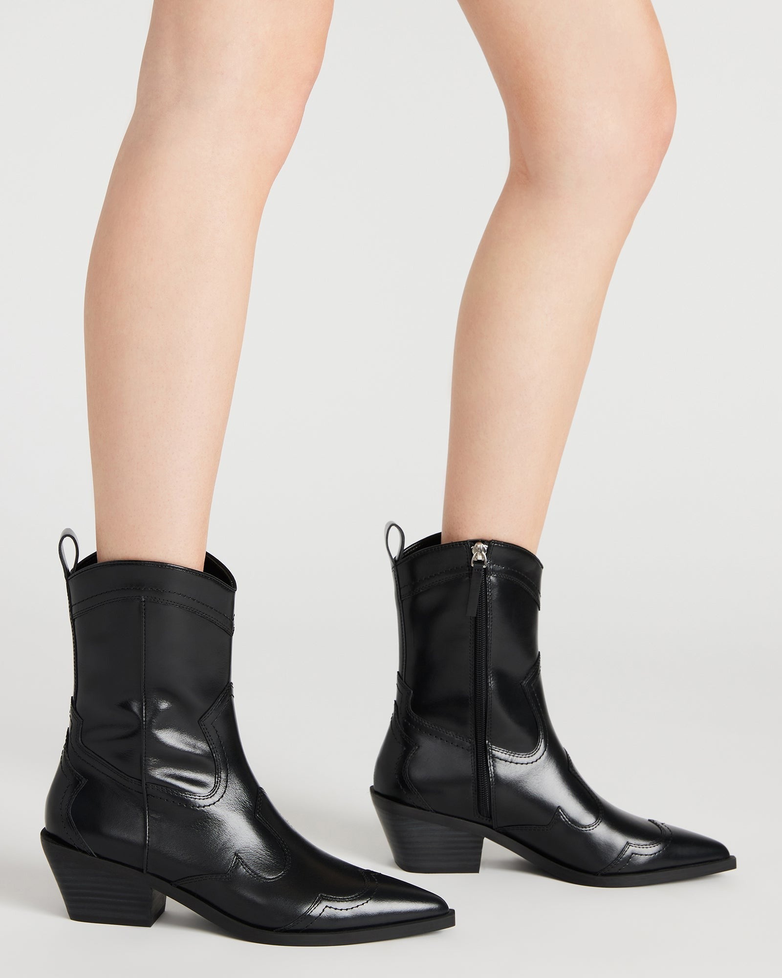 Close-up of the heel and shaft of white leather western boots