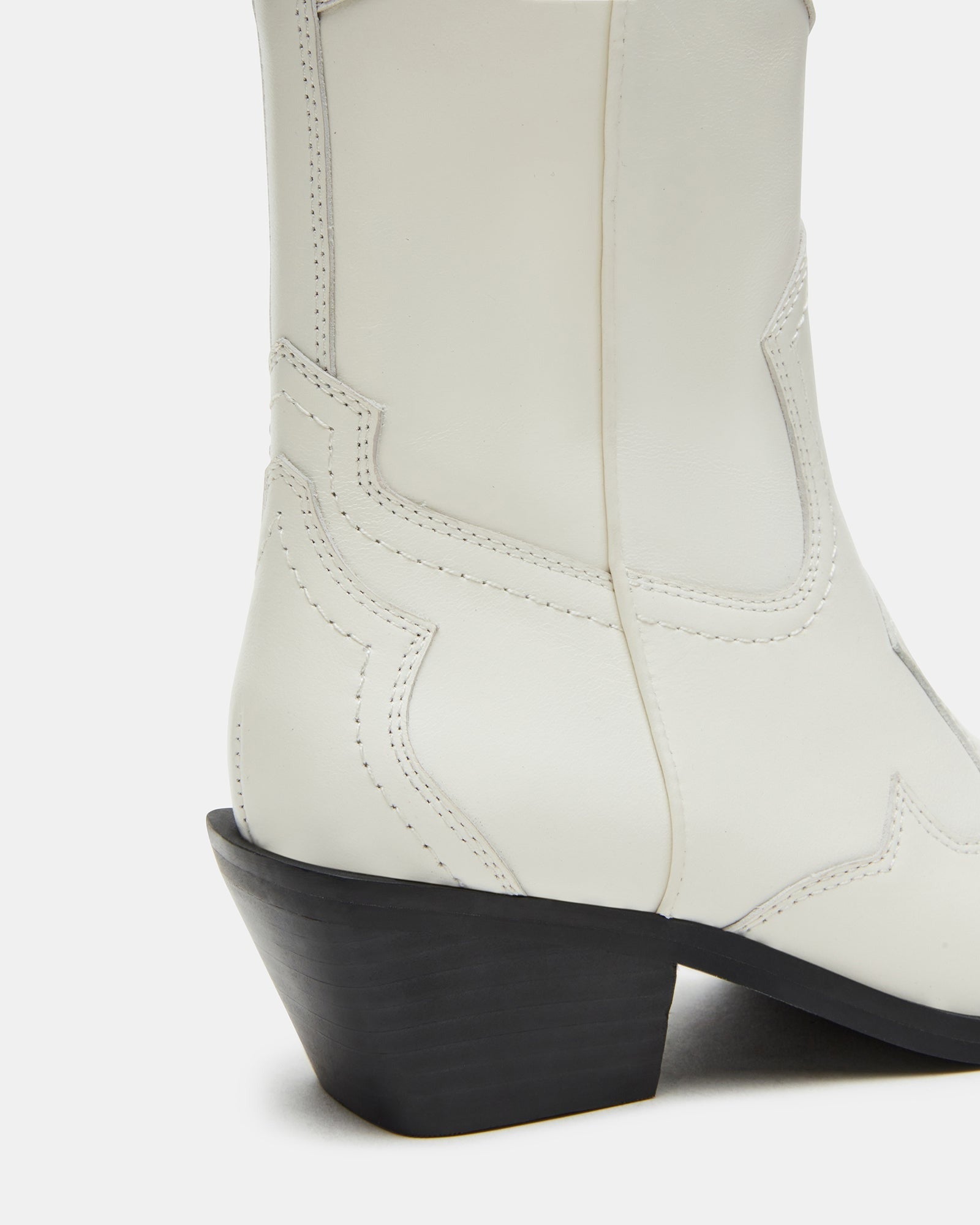Close-up of the heel and shaft of white leather western boots