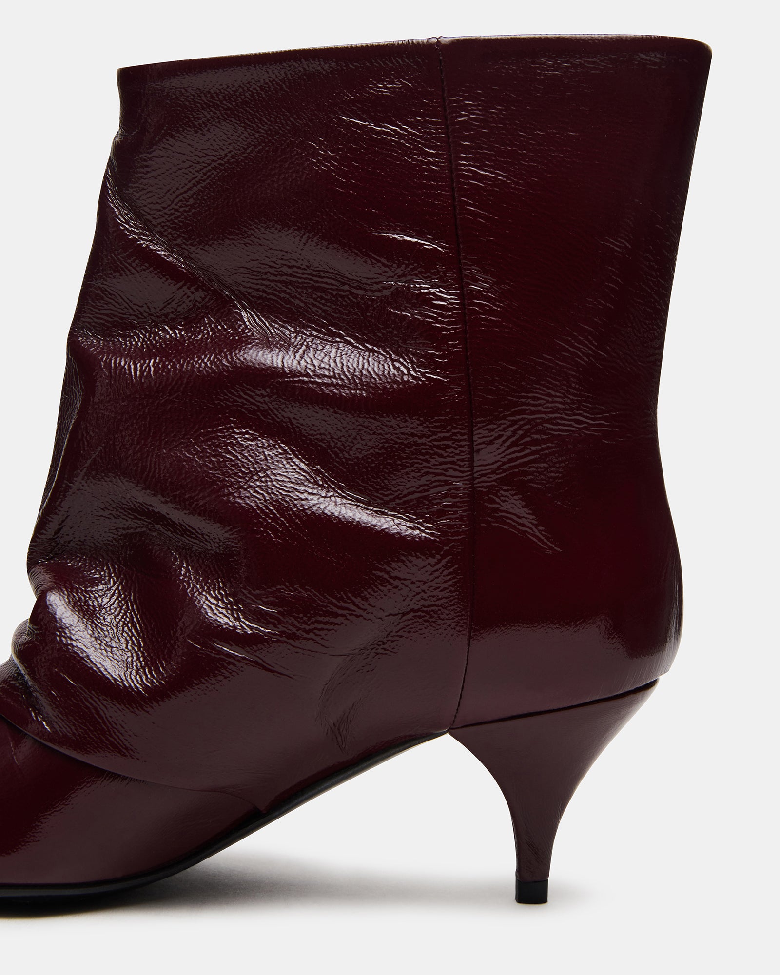Woman wearing black heel booties with skinny jeans