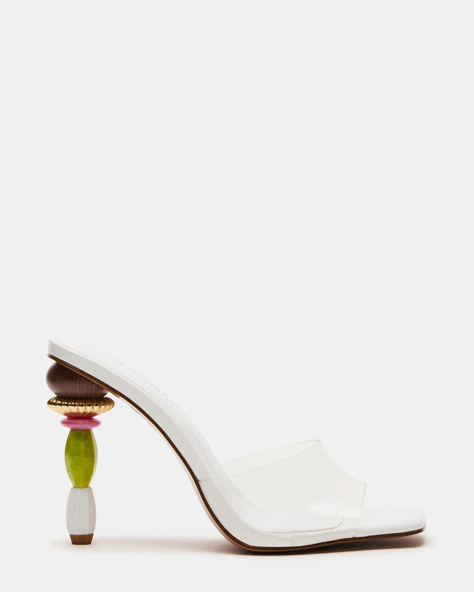 SIA square toe kitten heel mules displayed on a wooden shelf, showcasing the sculptured heel design.