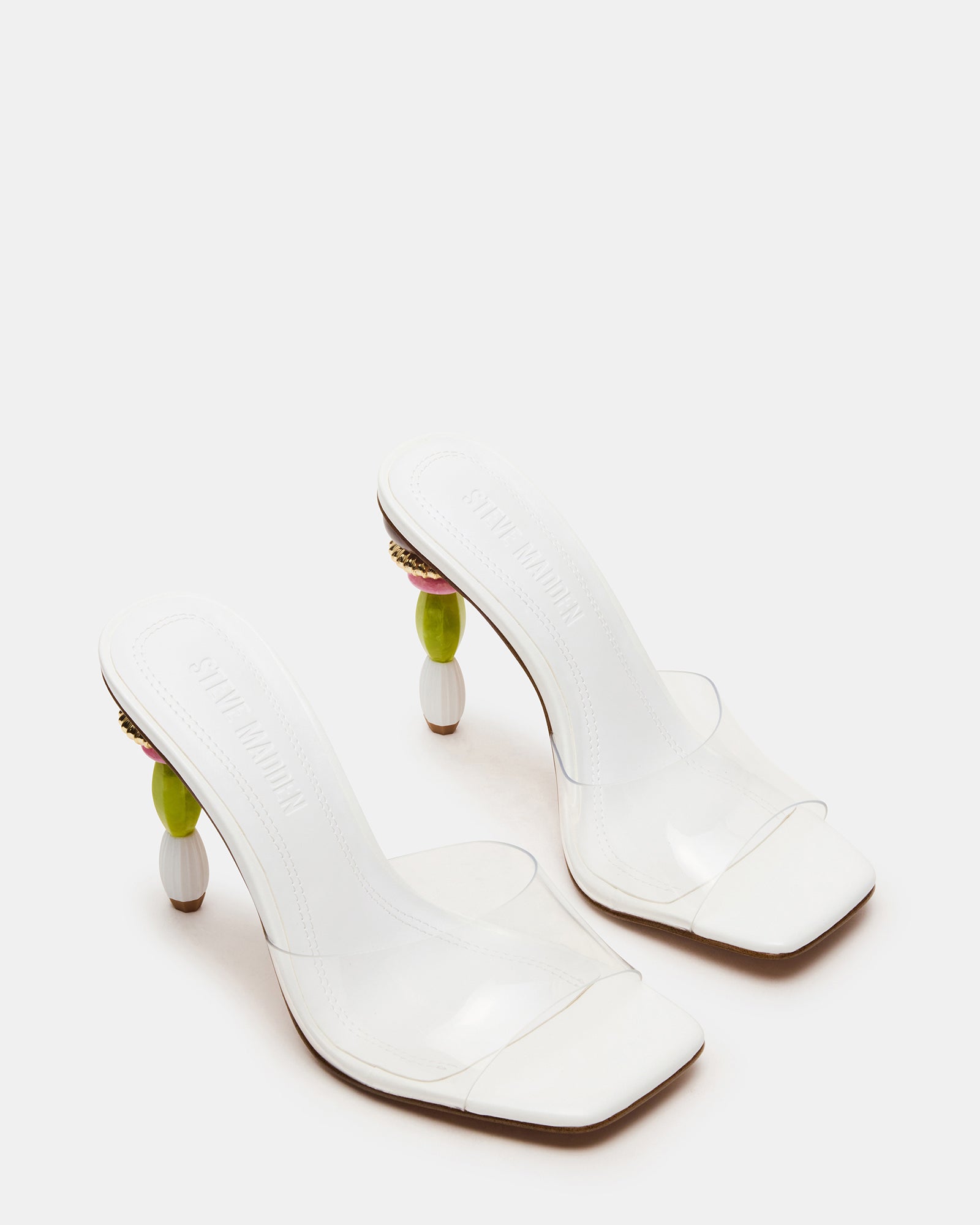 Close-up of the multi-colored sculptured heel on these black mule heels, highlighting the craftsmanship.