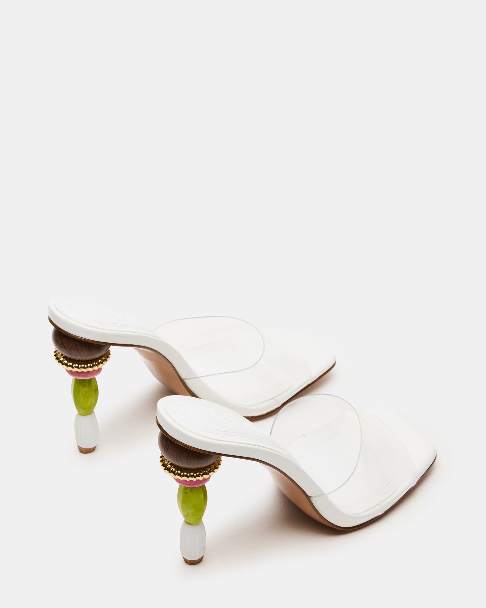 Close-up of the multi-colored sculptured heel on these black mule heels, highlighting the craftsmanship.