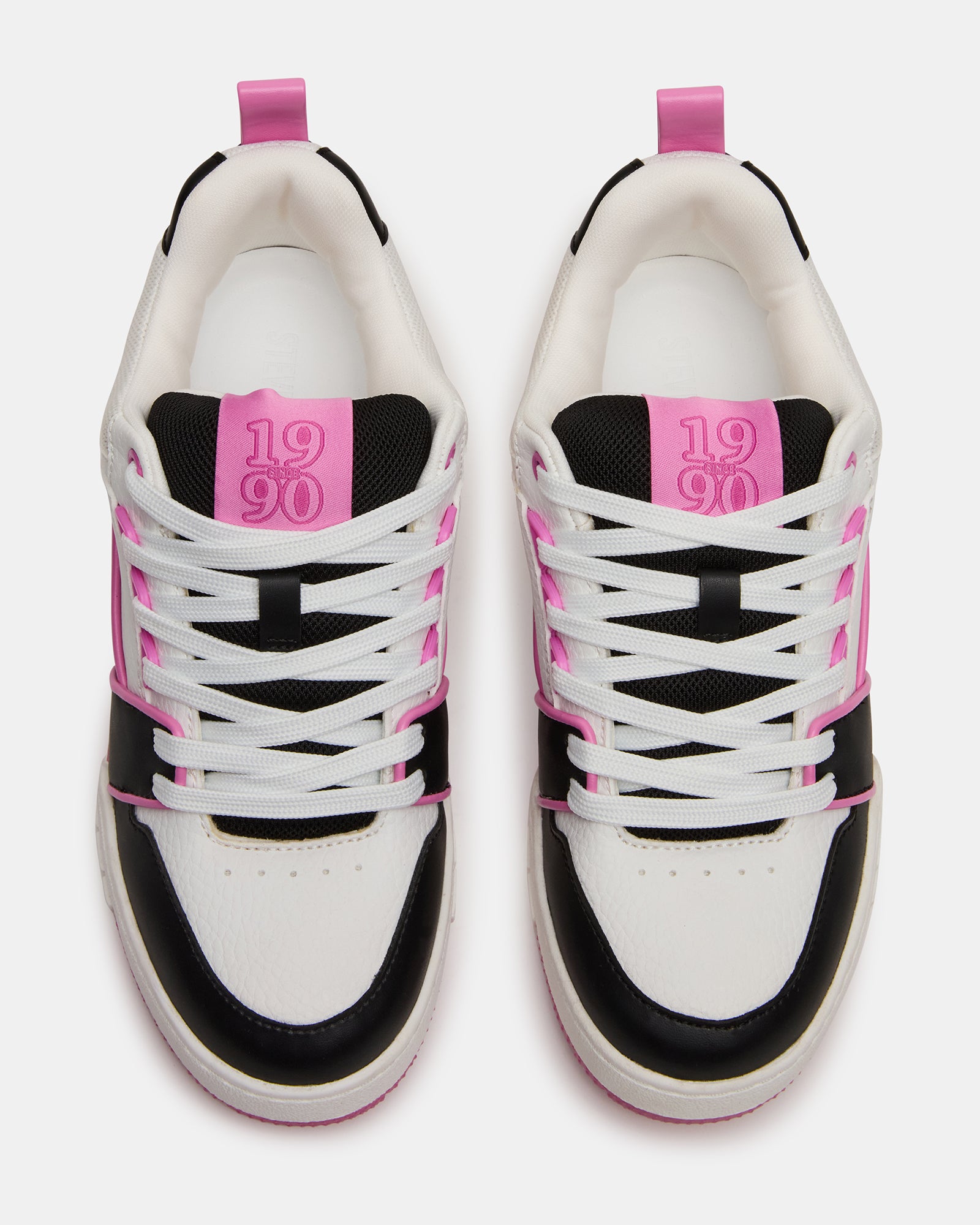 SKATER low-top sneakers on feet, showcasing the black and pink design