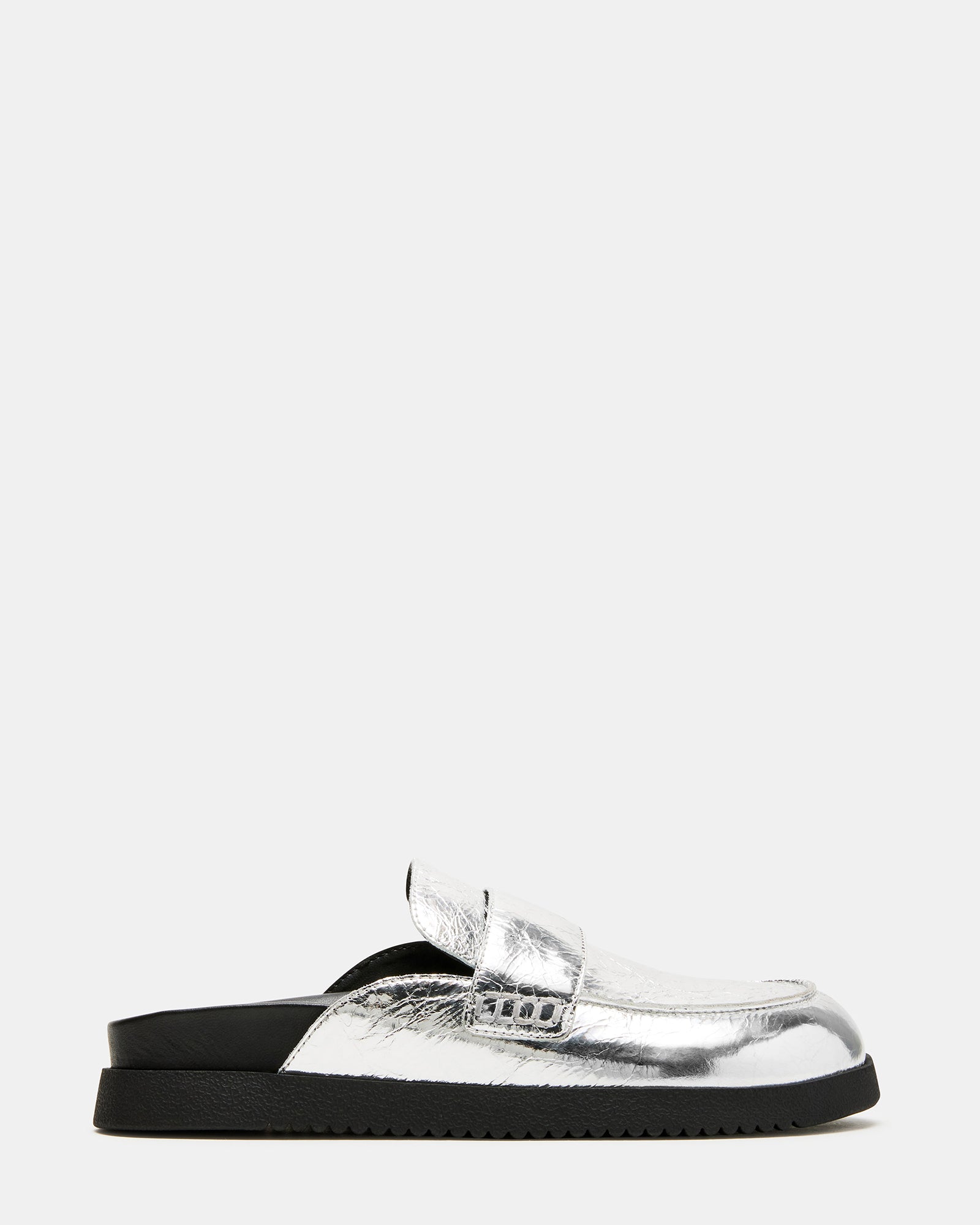 Skipper Silver Metallic Mules from the side, highlighting stitch details.