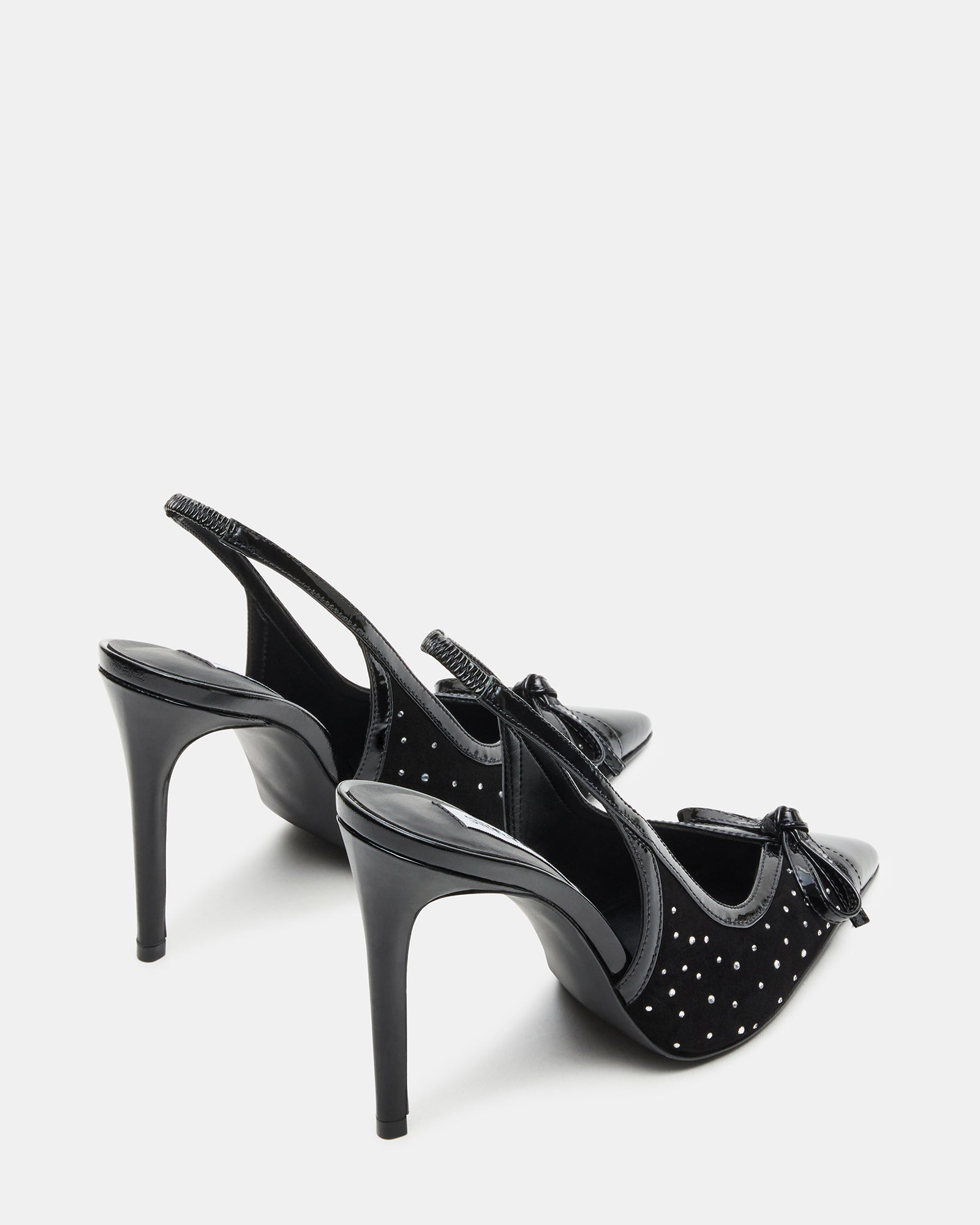 Close-up of platform stiletto heels highlighting suede texture