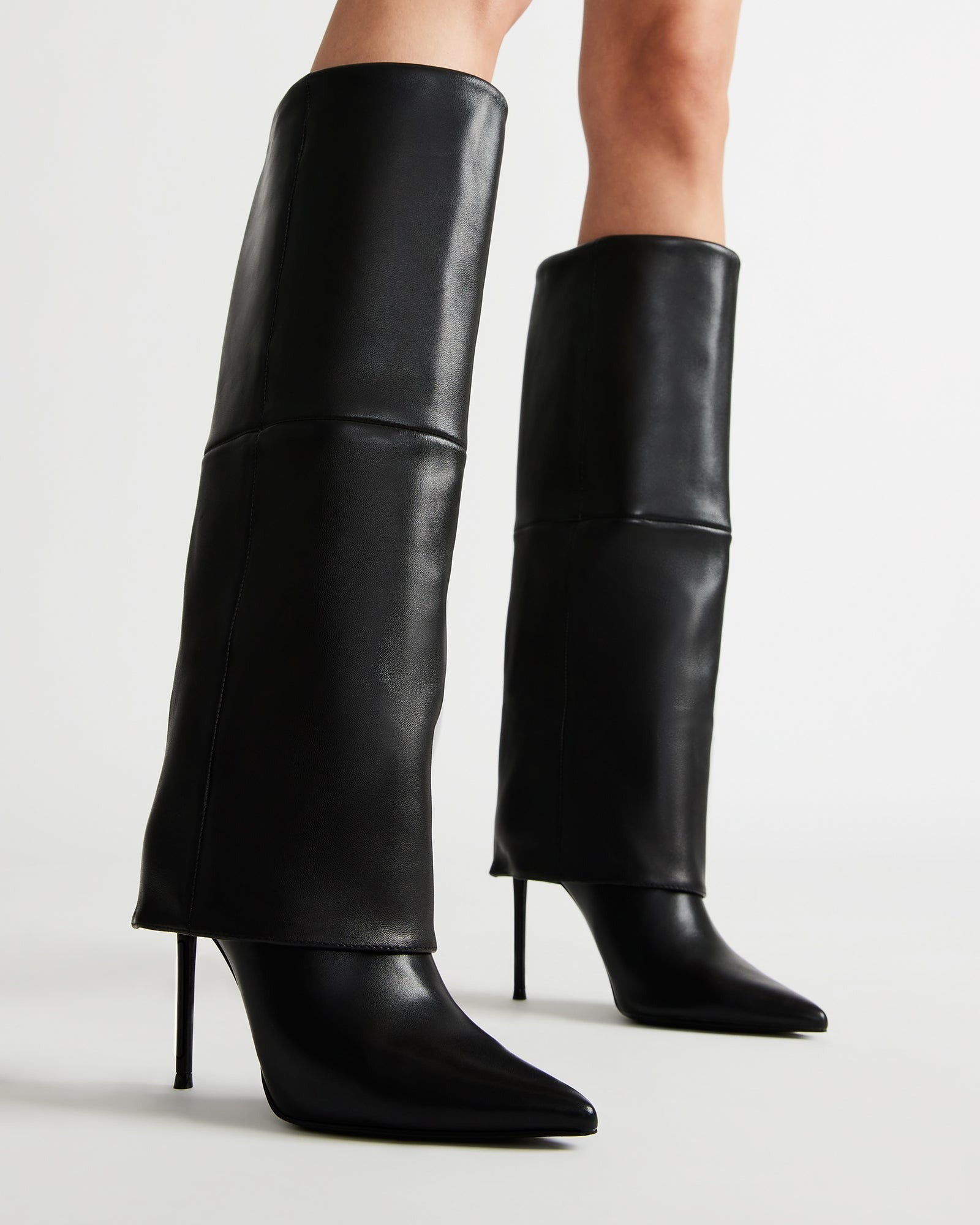 Side angle showing pointed toe and fold-over knee boot profile