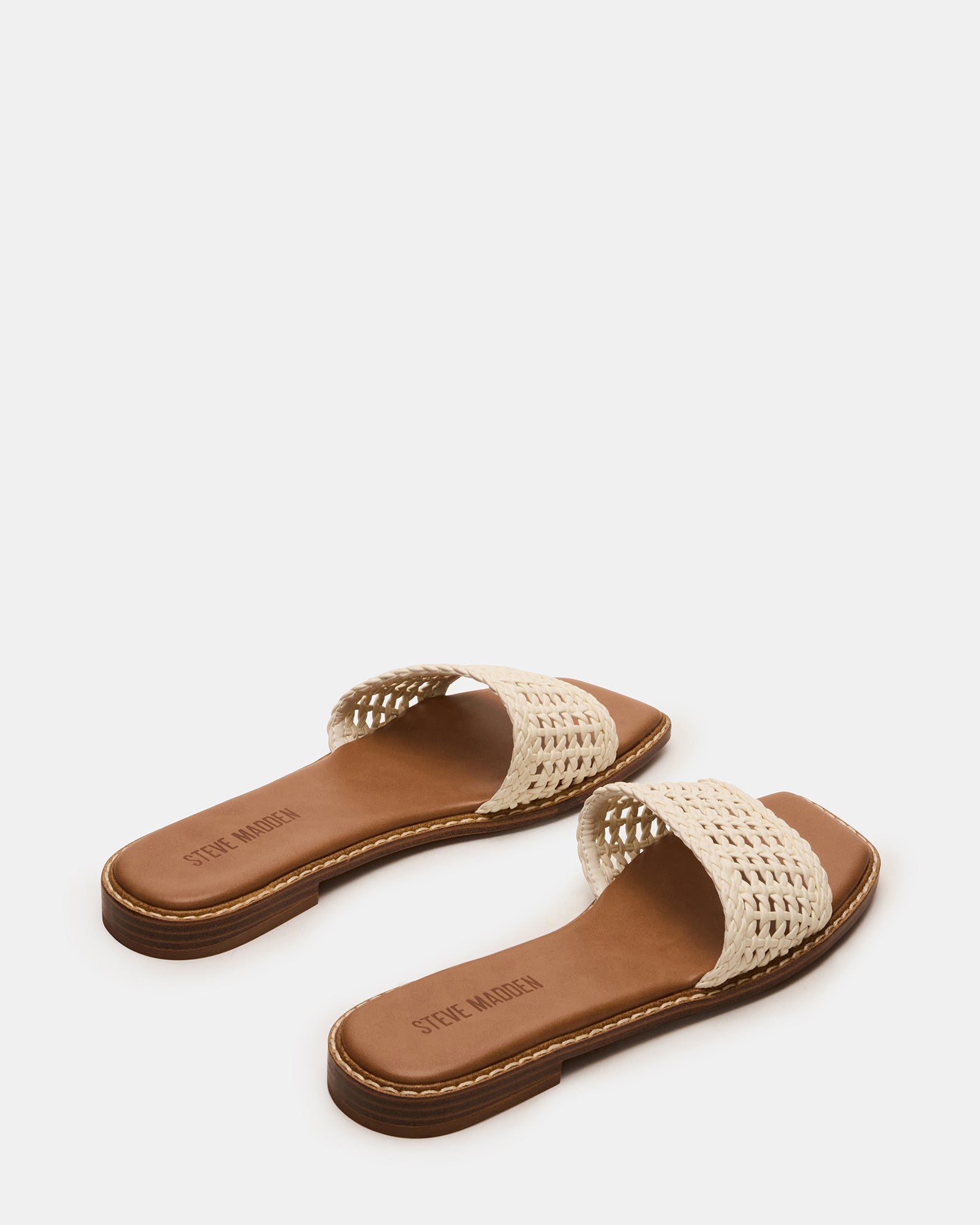 Pair of comfort sandals for women styled with a linen dress under soft morning light