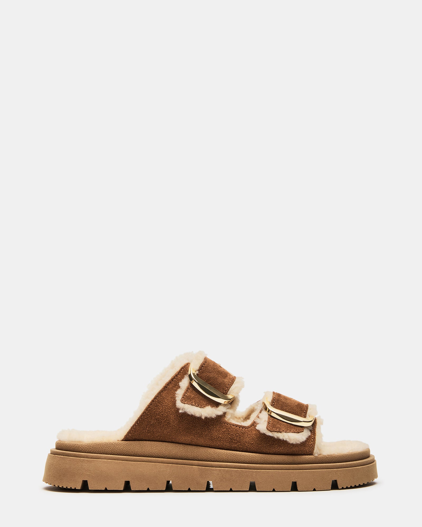 Close-up of tan suede flats with double straps and faux fur lining