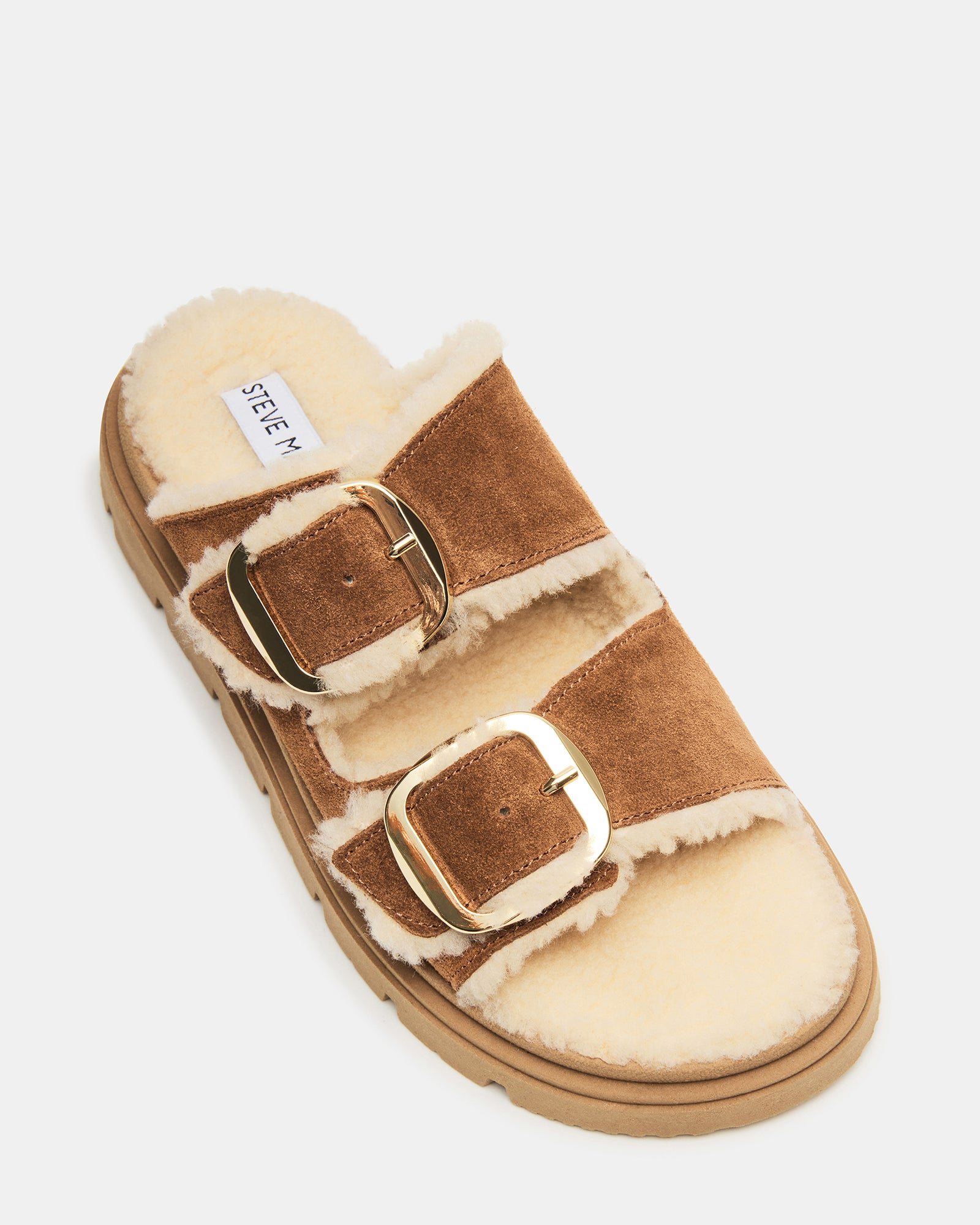 Side view of comfortable tan suede flats showing slip-on style