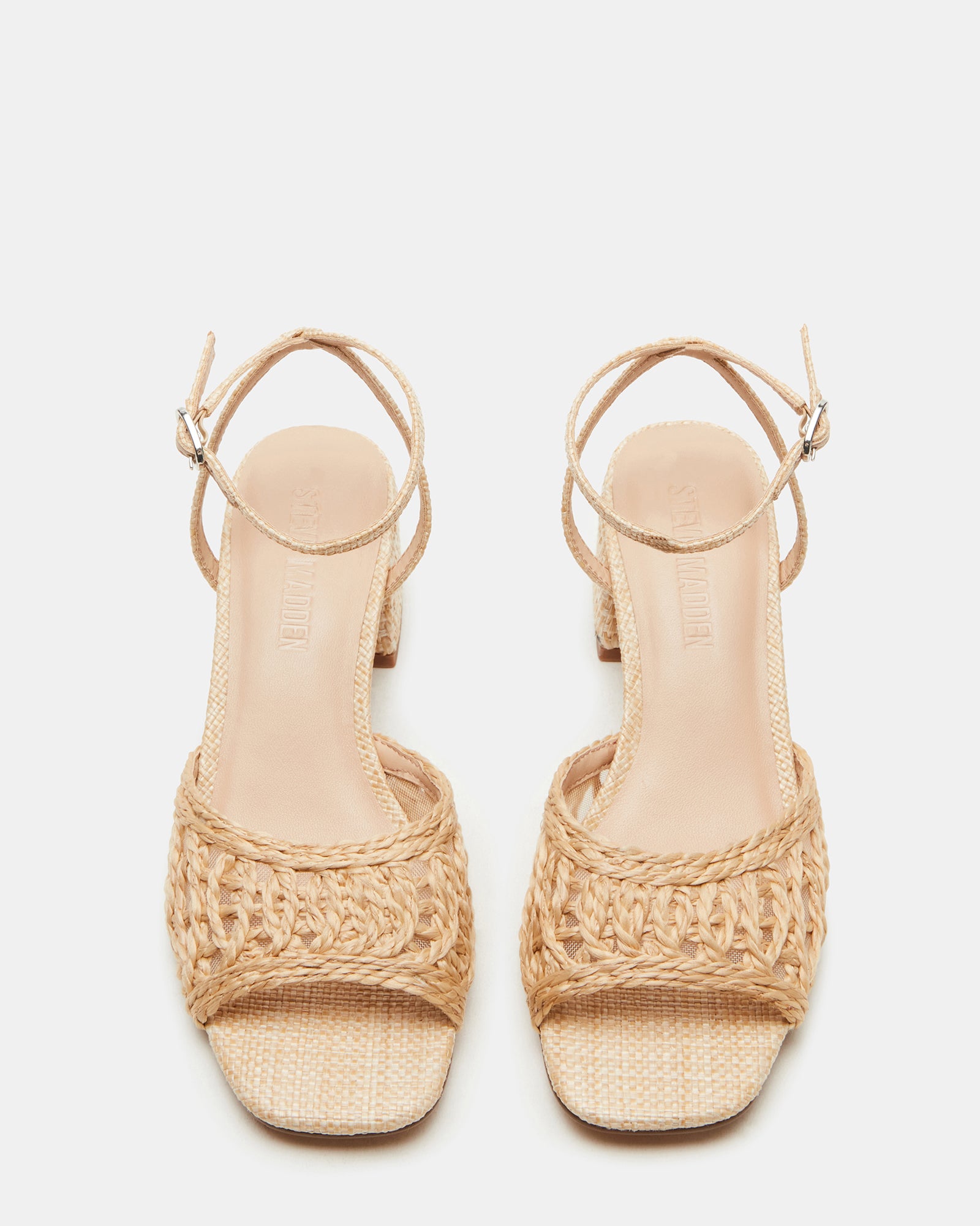 Side view of raffia platform sandals showing textured weave and ankle strap