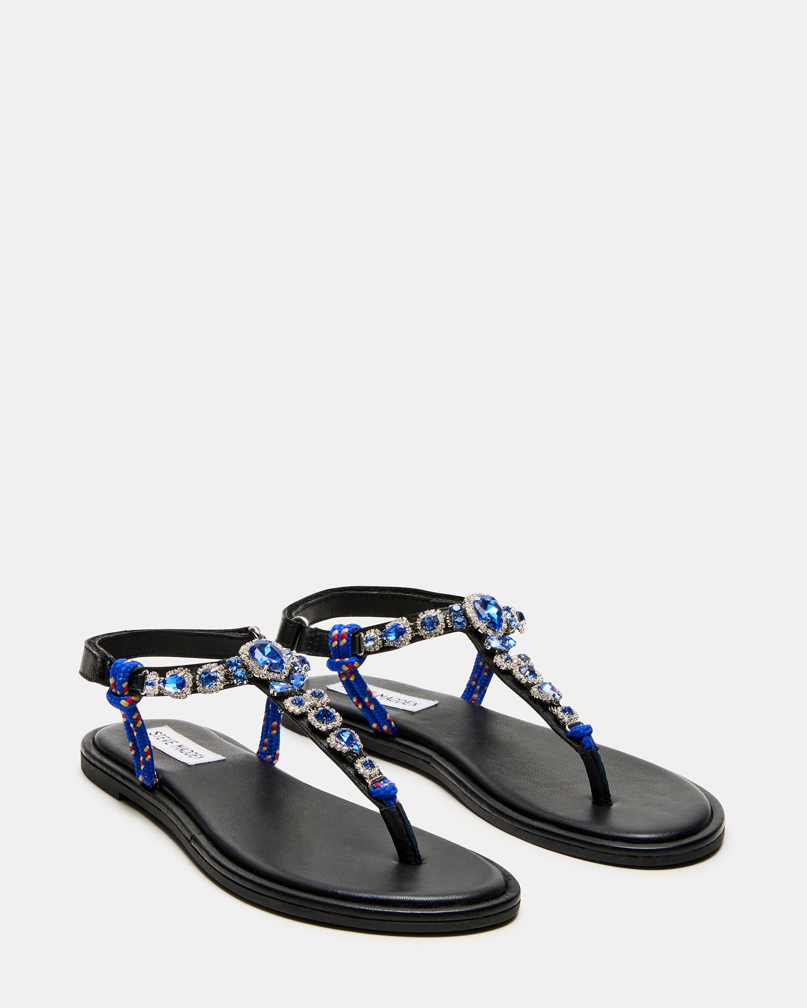 Side angle showcasing the leather upper and rhinestone detailing on the thong sandals