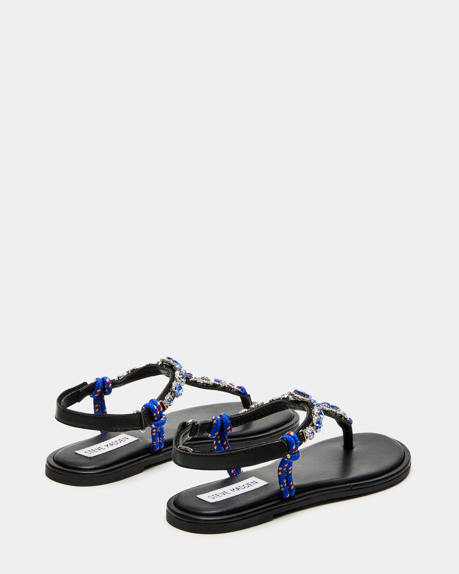 Side angle showcasing the leather upper and rhinestone detailing on the thong sandals