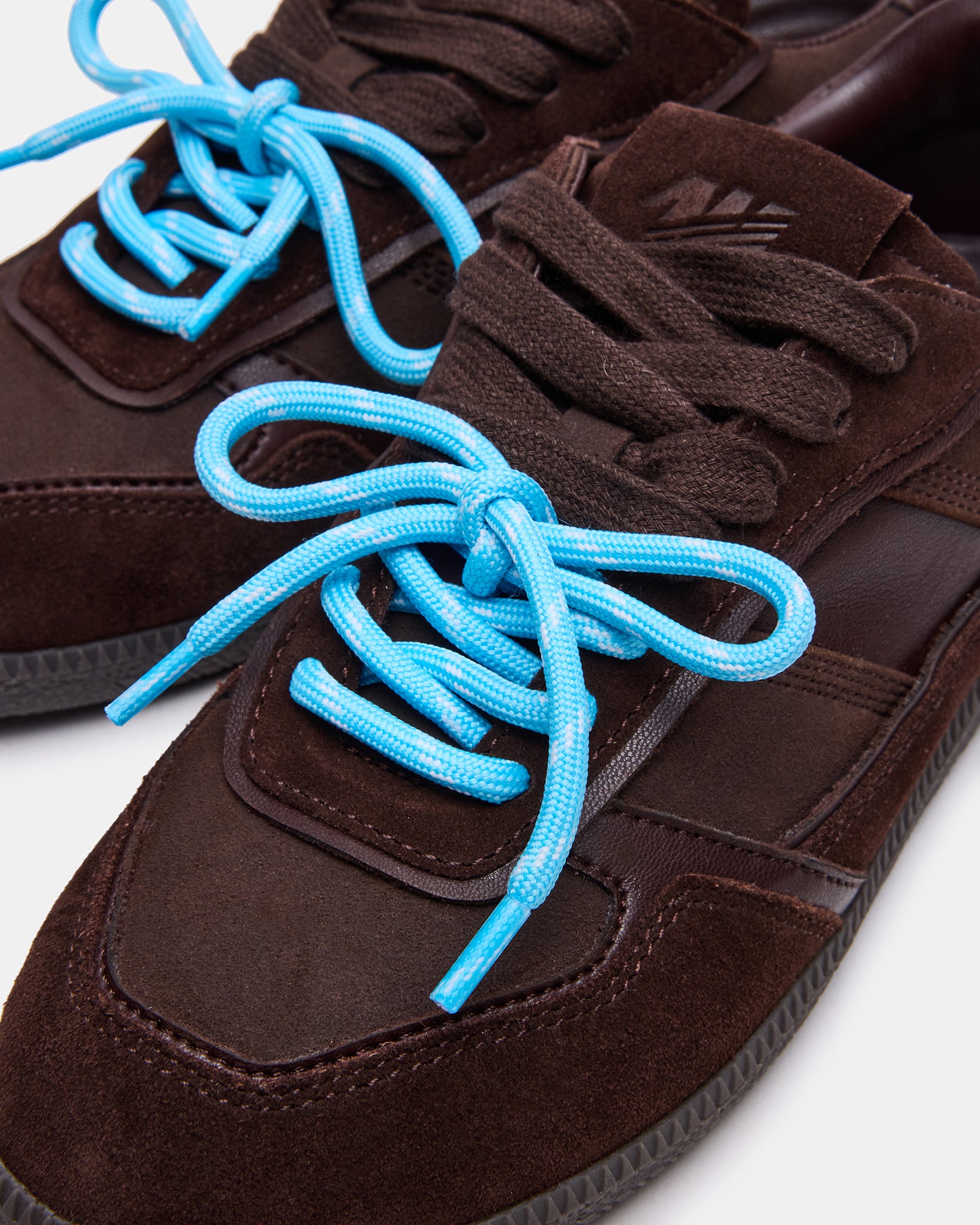 Lifestyle shot of Sporty Brown sneakers paired with casual attire for daily wear