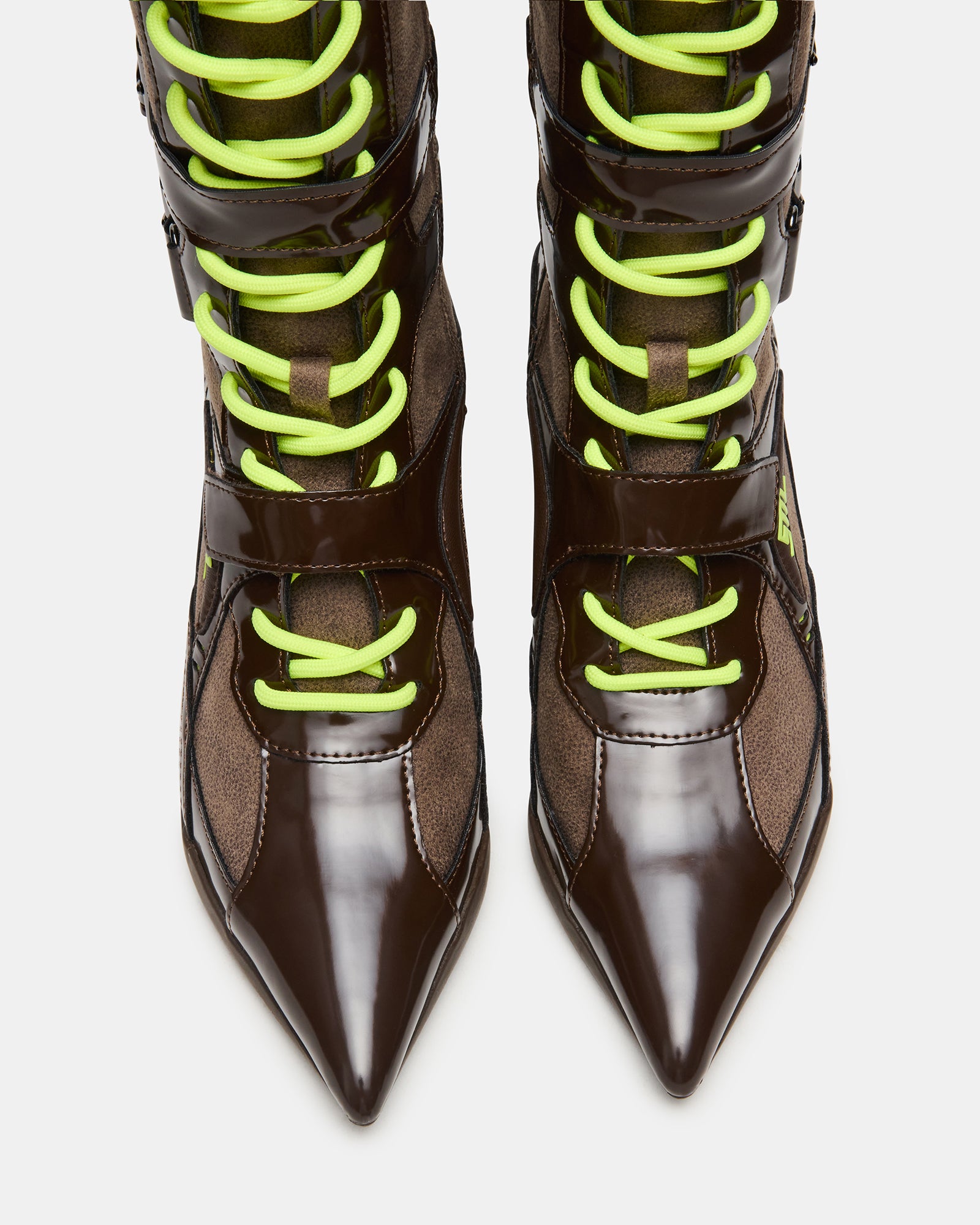 Side view of Stark brown knee-high boots with pointed toe and buckle accents