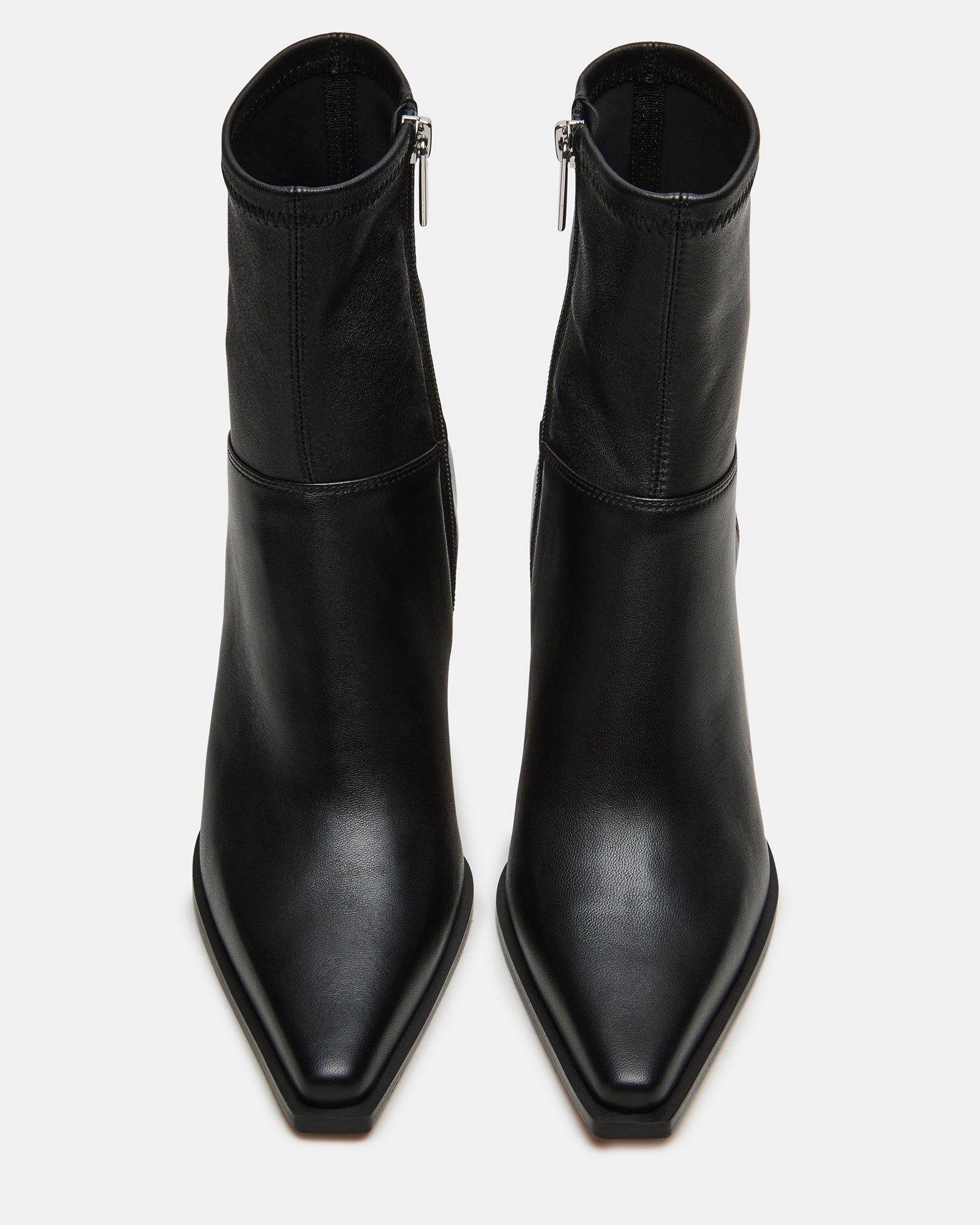 Stasia kitten heel booties paired with a chic outfit.