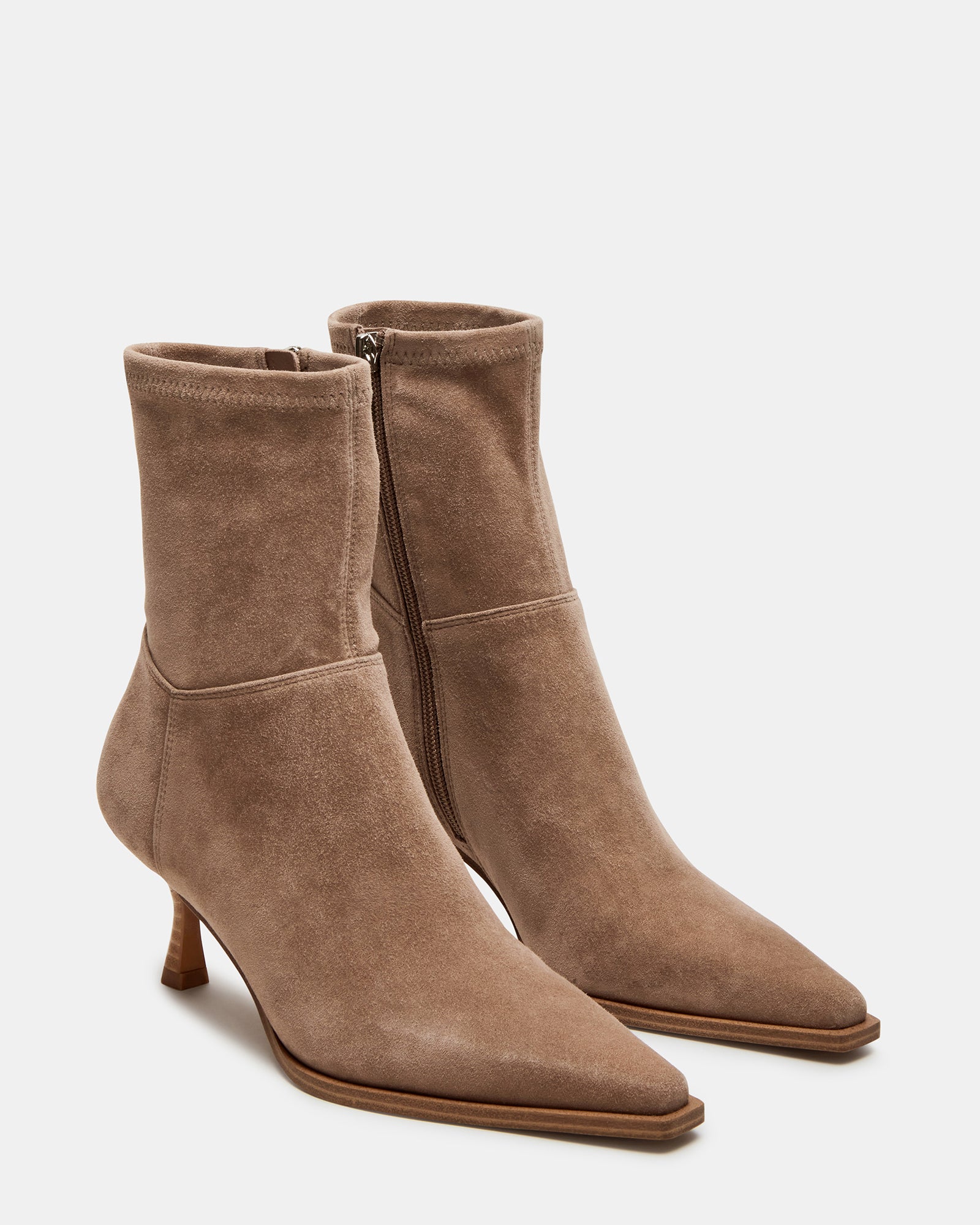 Top-down view of black suede bootie boots and taupe pair side-by-side for comparison.