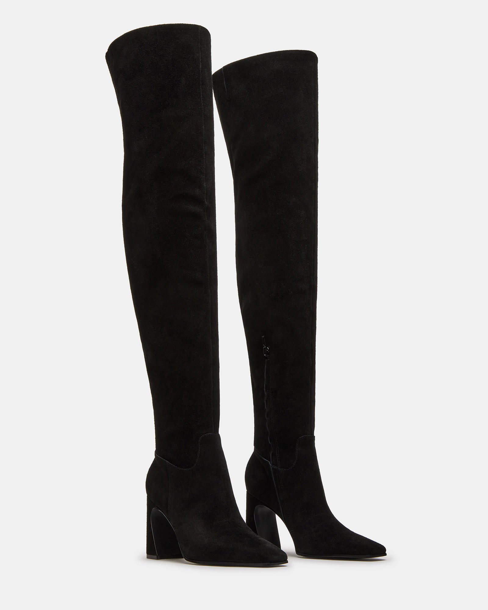 Fashionable women wearing black suede over-the-knee boots with skirt