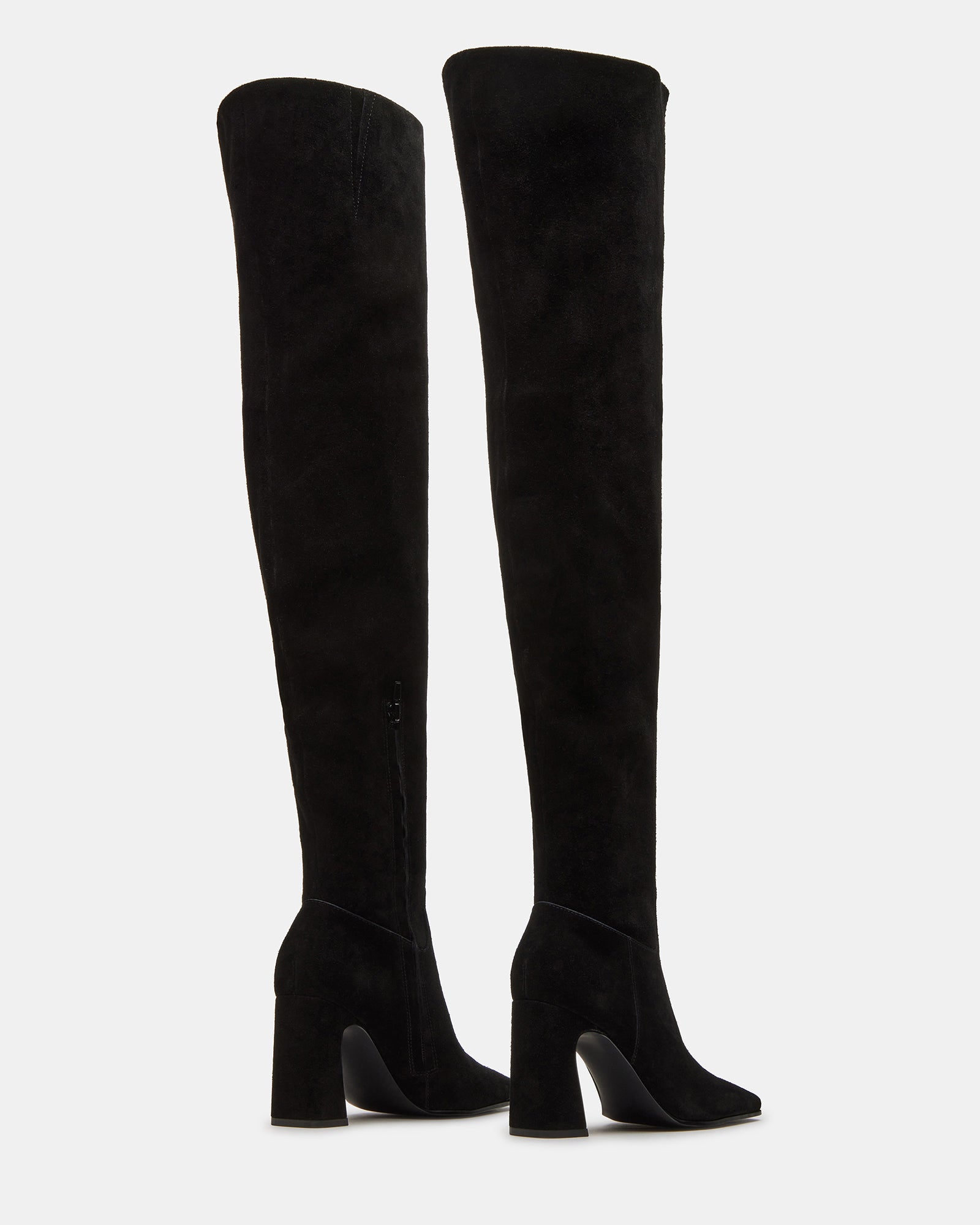 Fashionable women wearing black suede over-the-knee boots with skirt