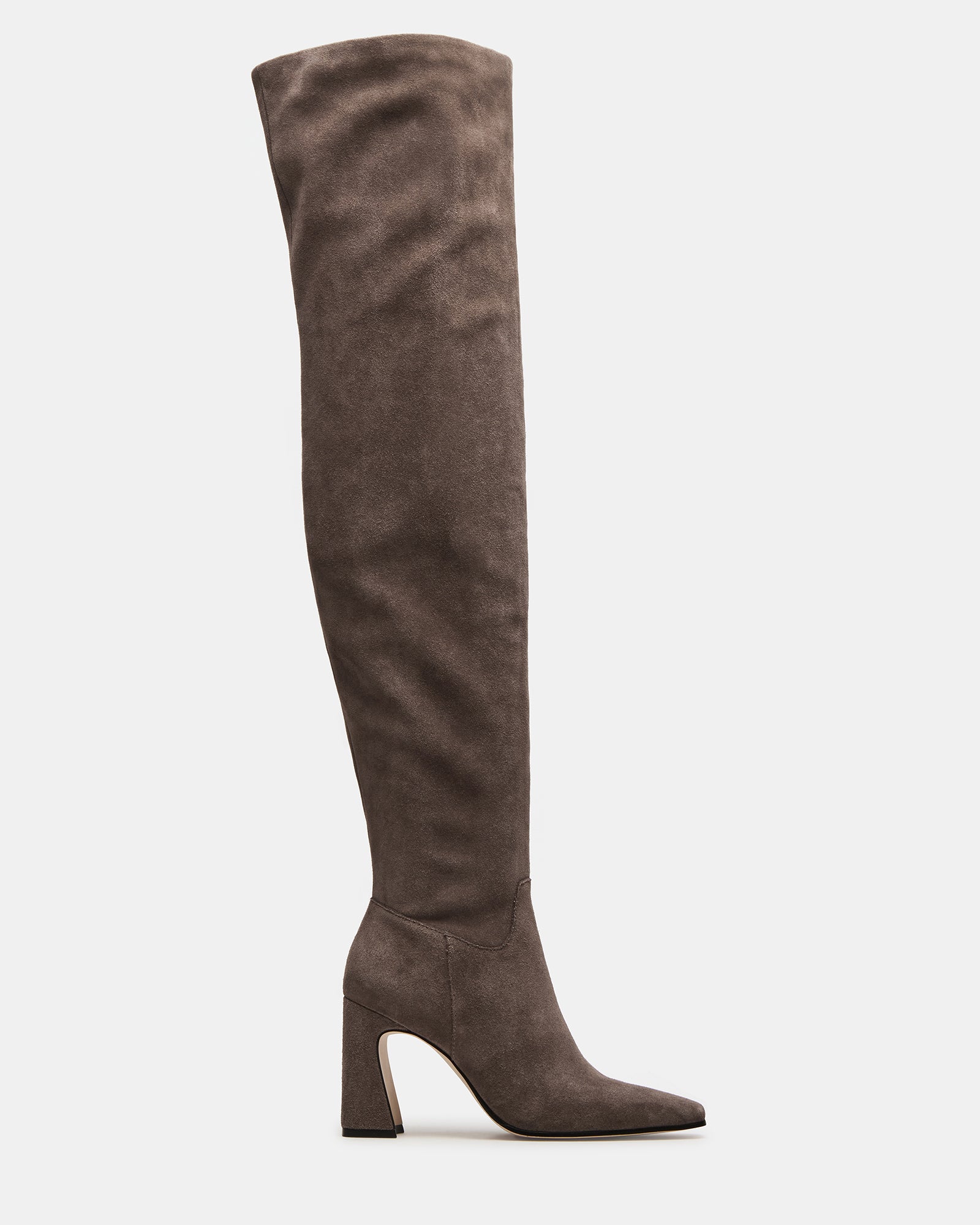 Side view of grey suede over the knee black boots styled with jeans