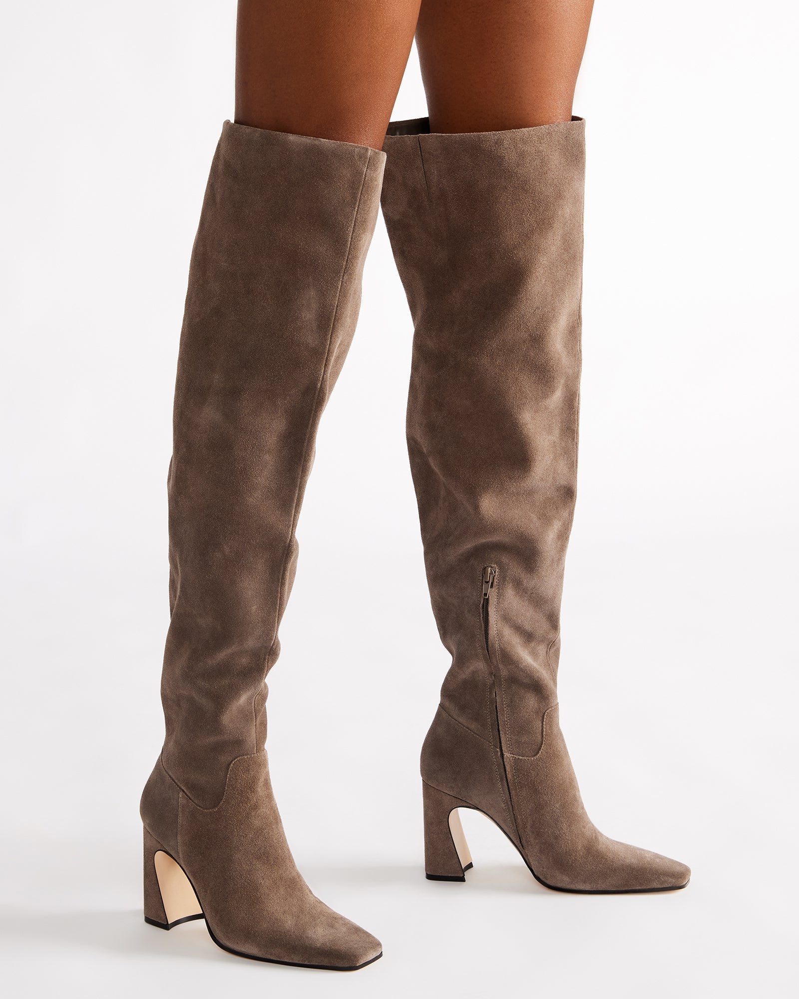 Front angle showing square toe and high heel boots on hardwood flooring