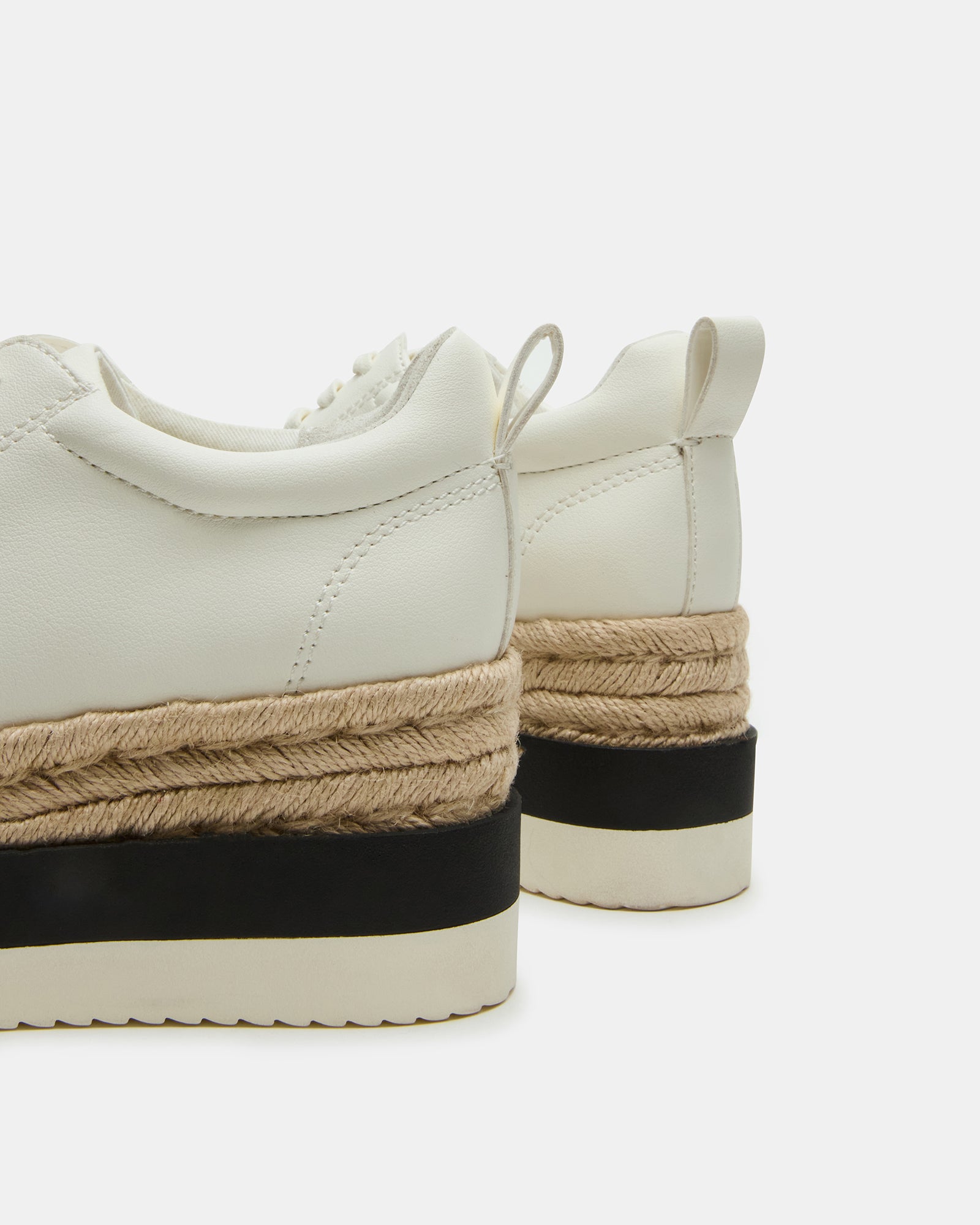 Close-up of vegan sneakers lace-up design and low-top finish.